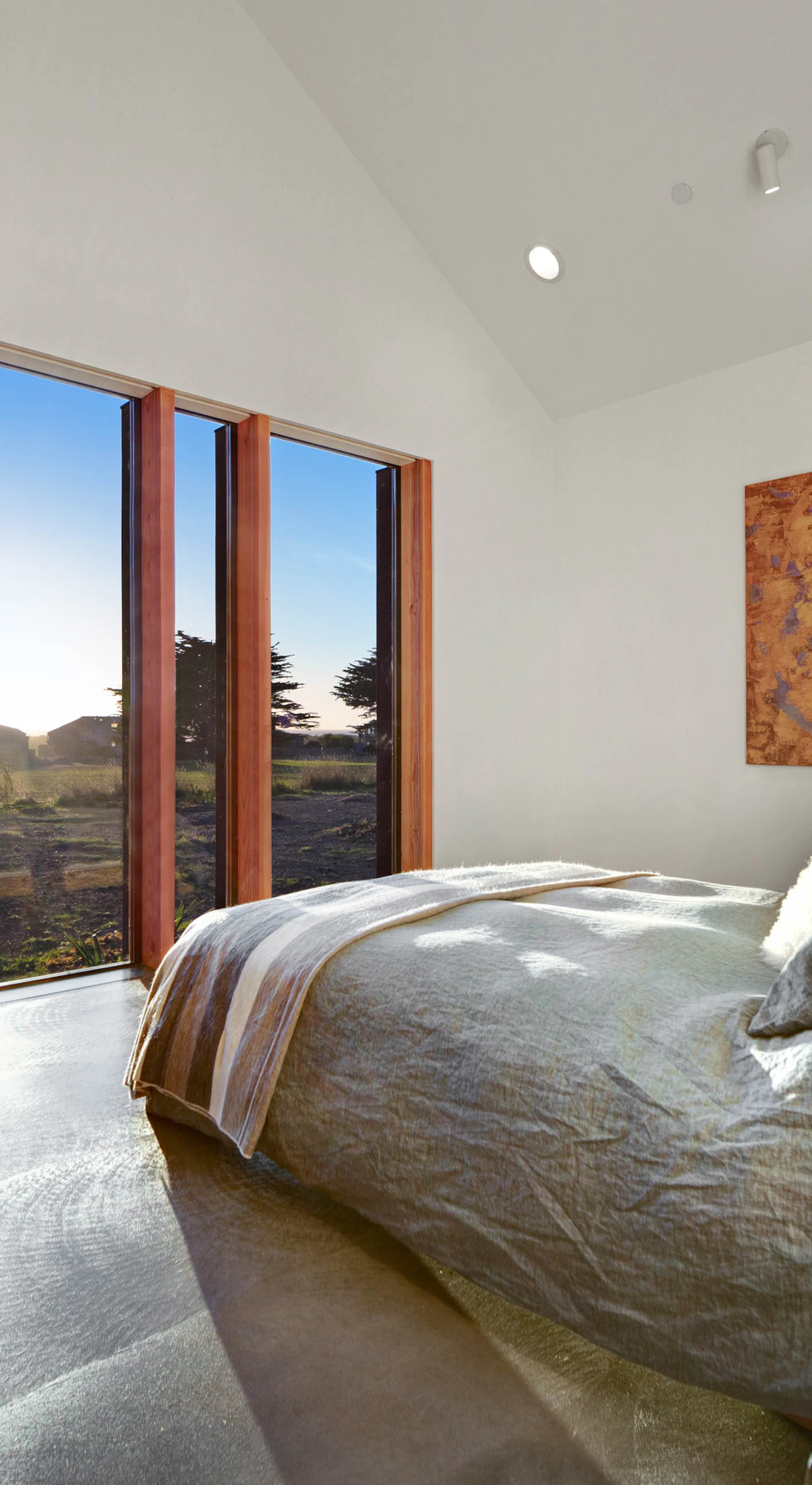 Wake up to breathtaking ocean views in this tranquil master bedroom, your serene retreat after a day of exploration.