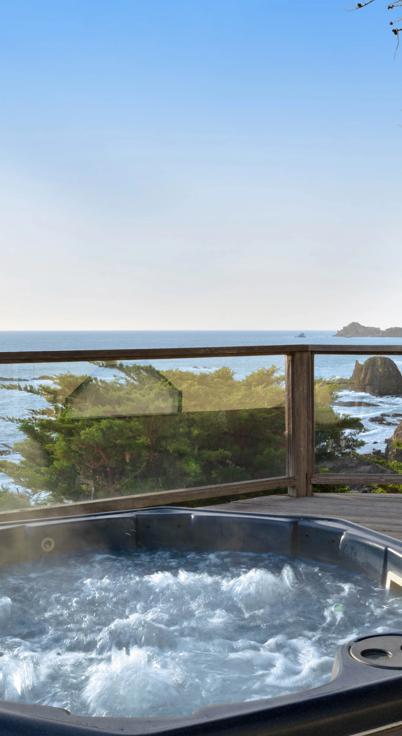 Soak in the hot tub under the stars, with the soothing sounds of the ocean waves just a heartbeat away.