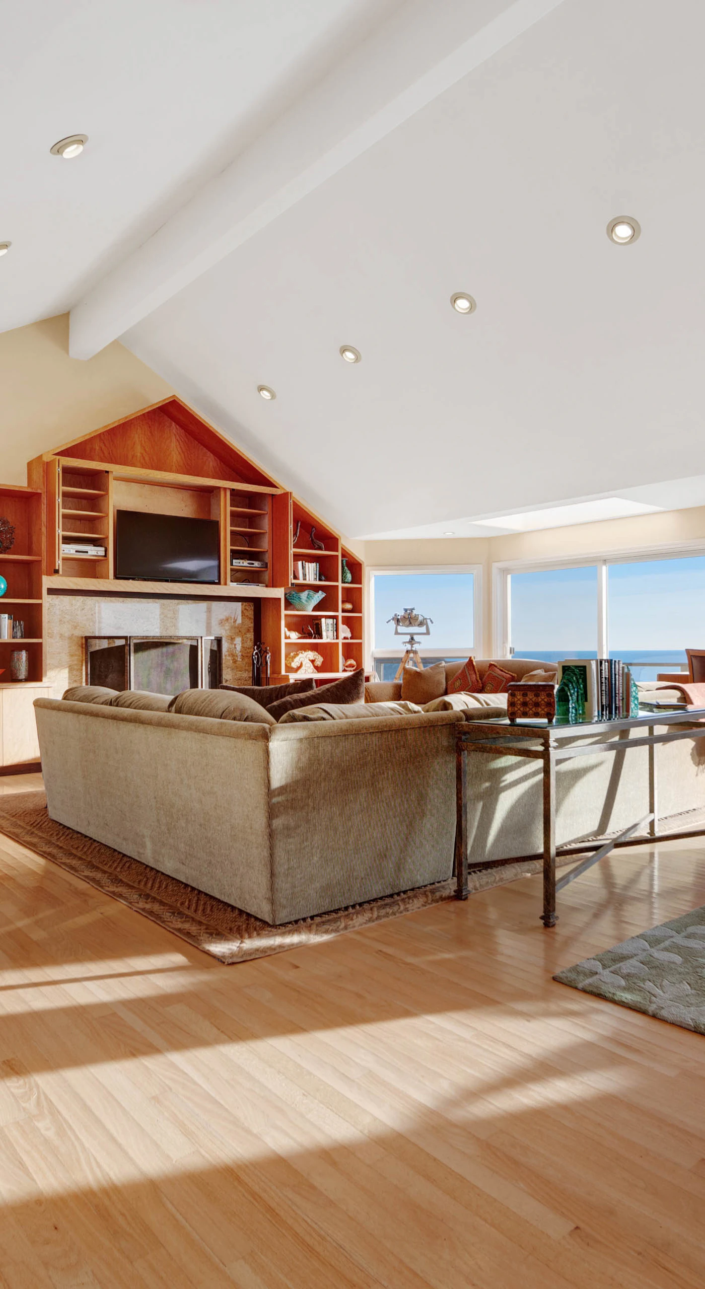 Morning light fills the living room, inviting you to relax with a book or enjoy a cozy evening by the wood-burning fireplace.