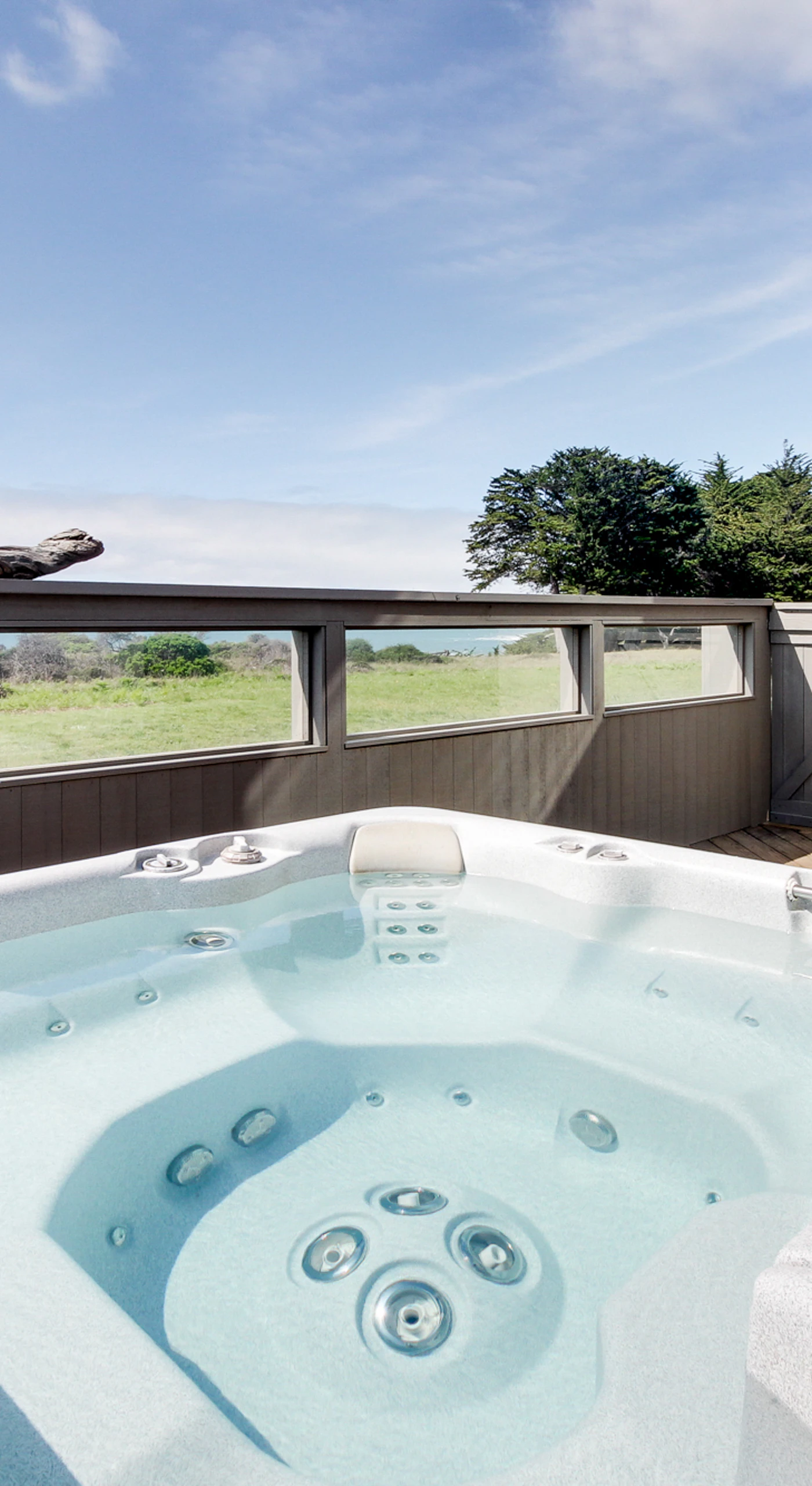 Soak in the private hot tub, where you can unwind under the open sky while taking in the ocean's beauty and the soothing sounds of nature.