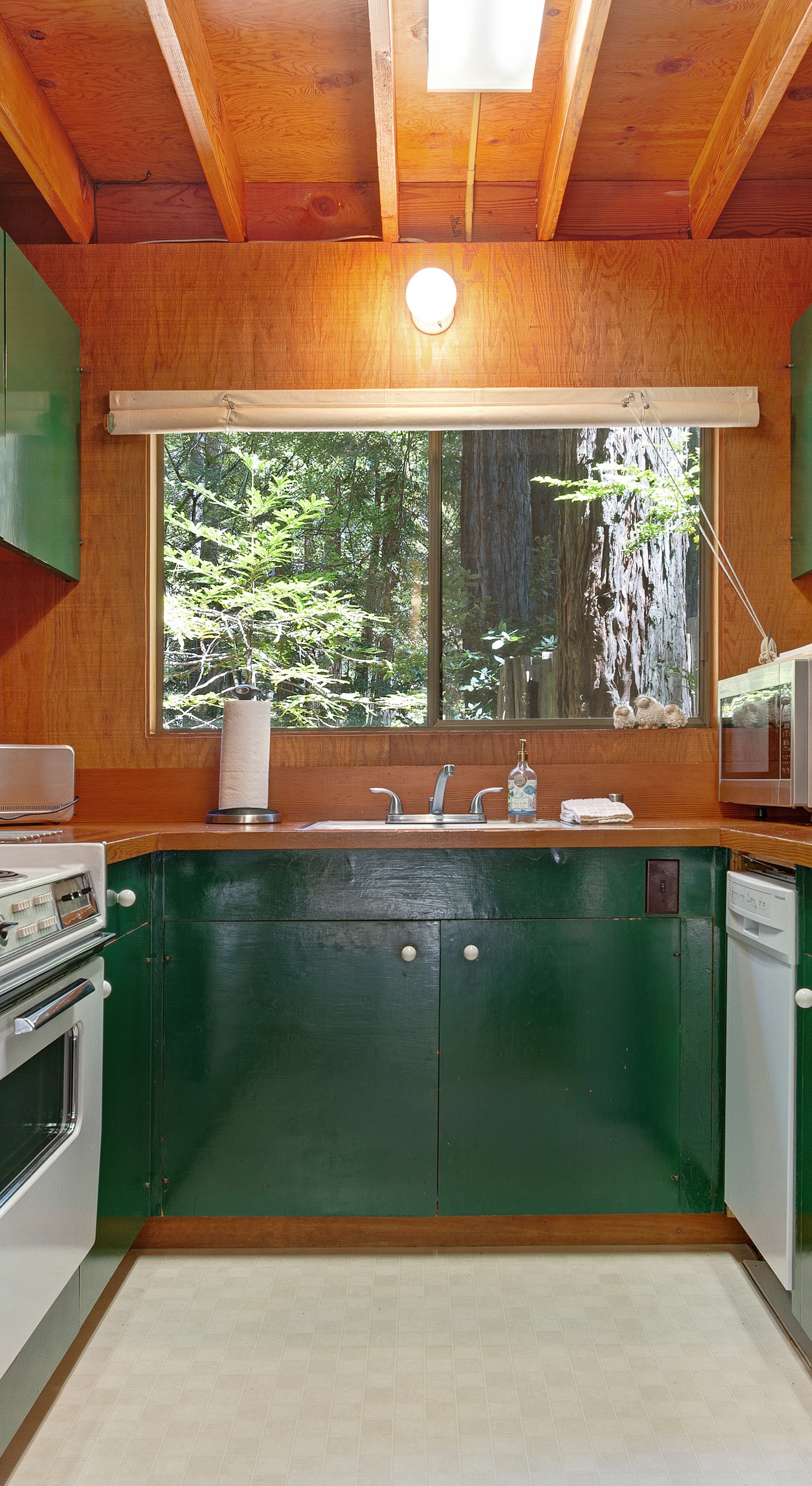 Whip up your favorite meals in the well-equipped kitchen, where the vibrant colors and natural light create an inviting space for culinary creativity.