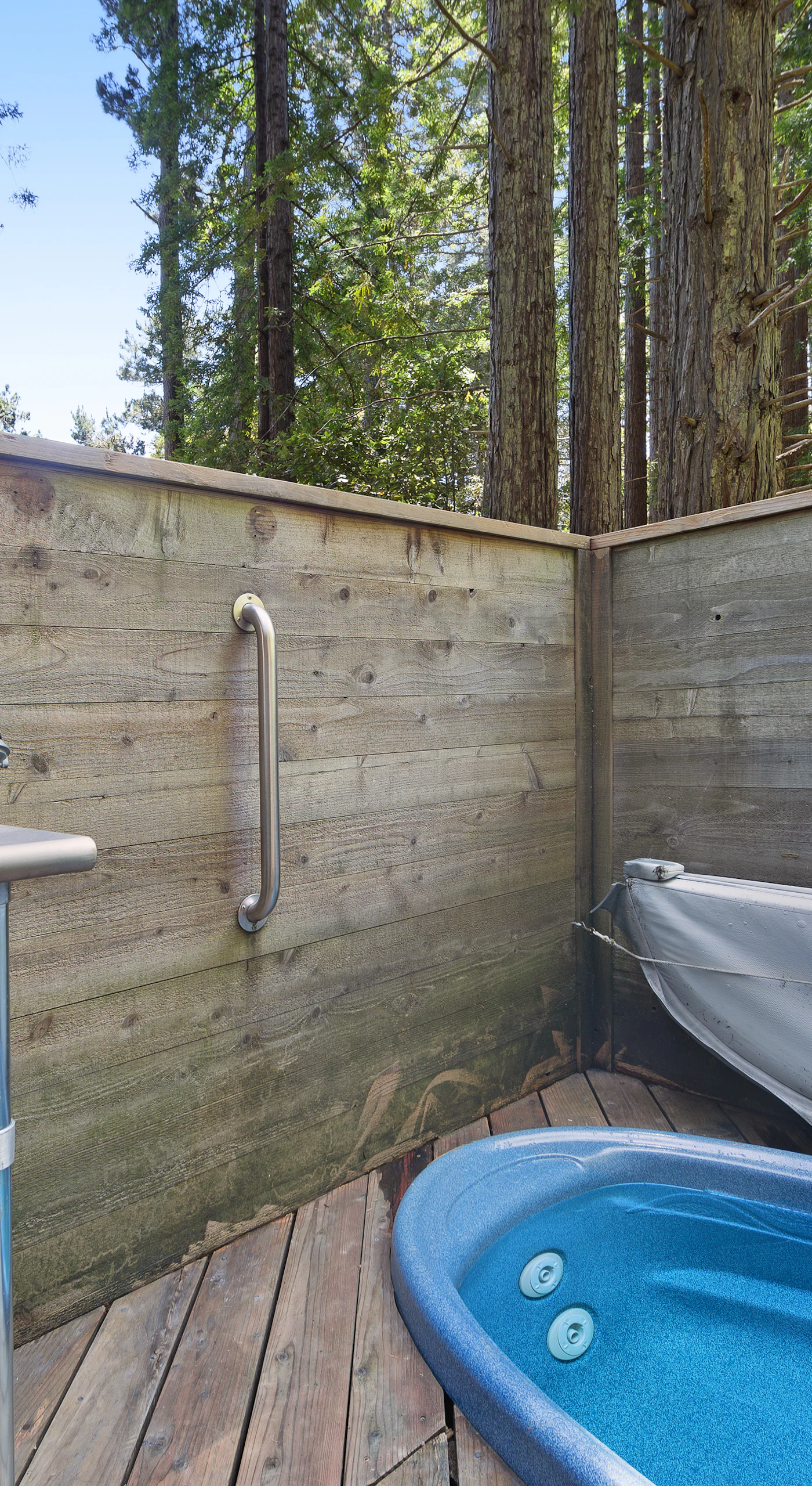 Imagine soaking in the private hot tub, surrounded by towering redwoods, as you unwind under the stars after a day of adventure.