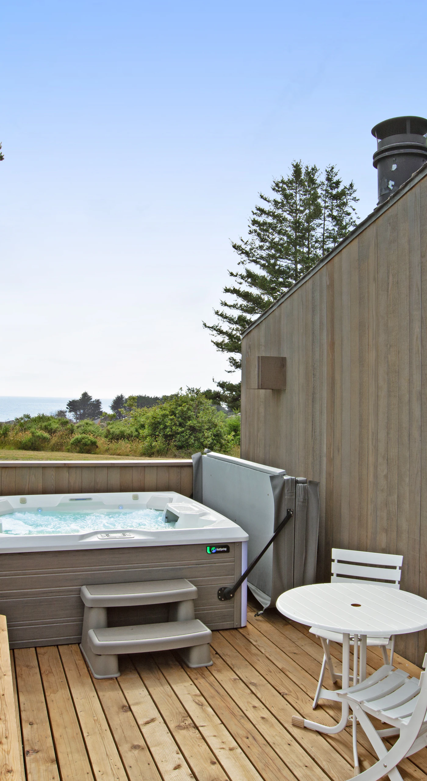 Step into your private hot tub and soak in the tranquility, surrounded by nature and ocean breezes.