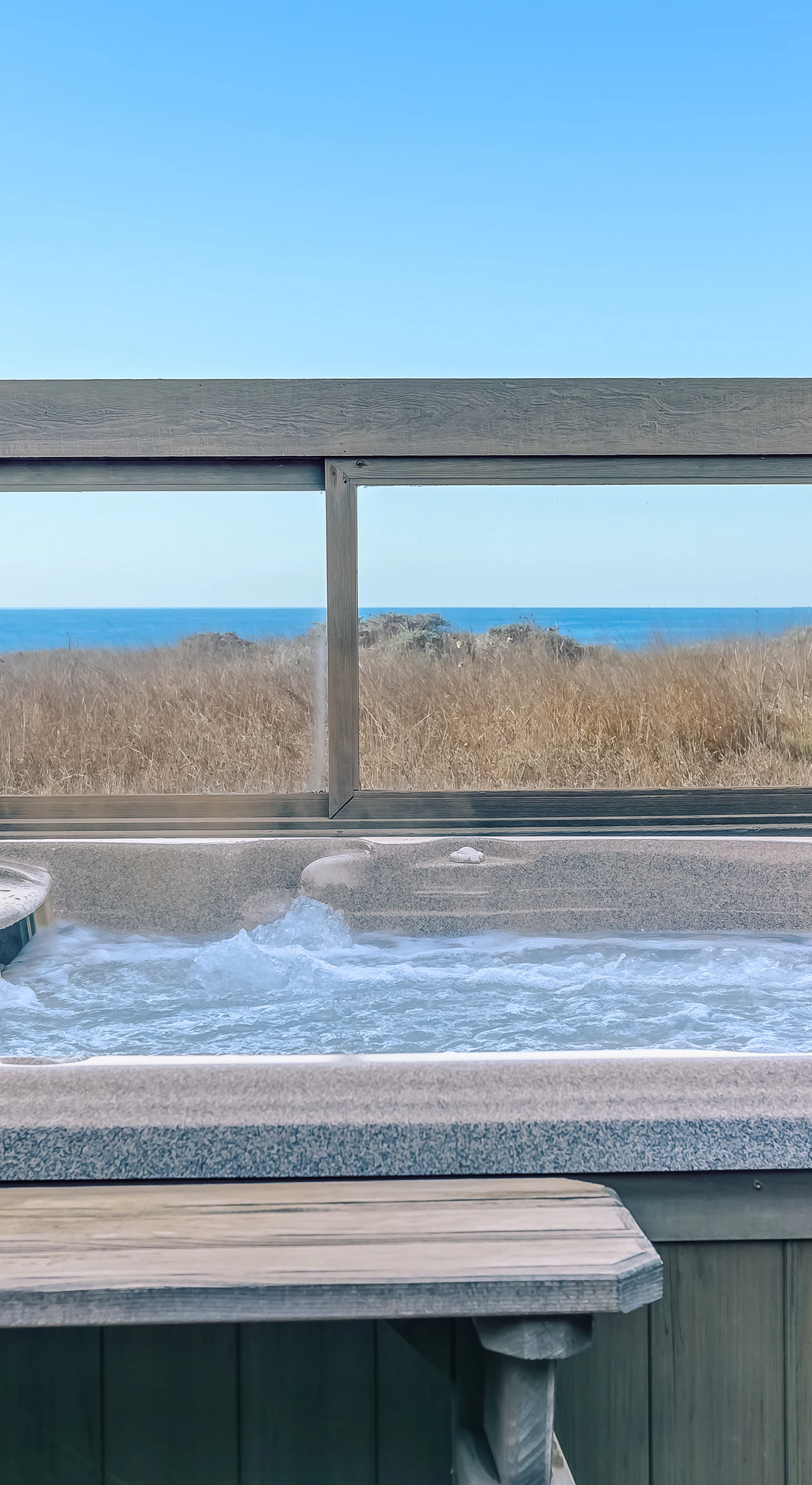 Step into your private hot tub, where you can soak under the stars while enjoying breathtaking ocean views that enhance your relaxation.
