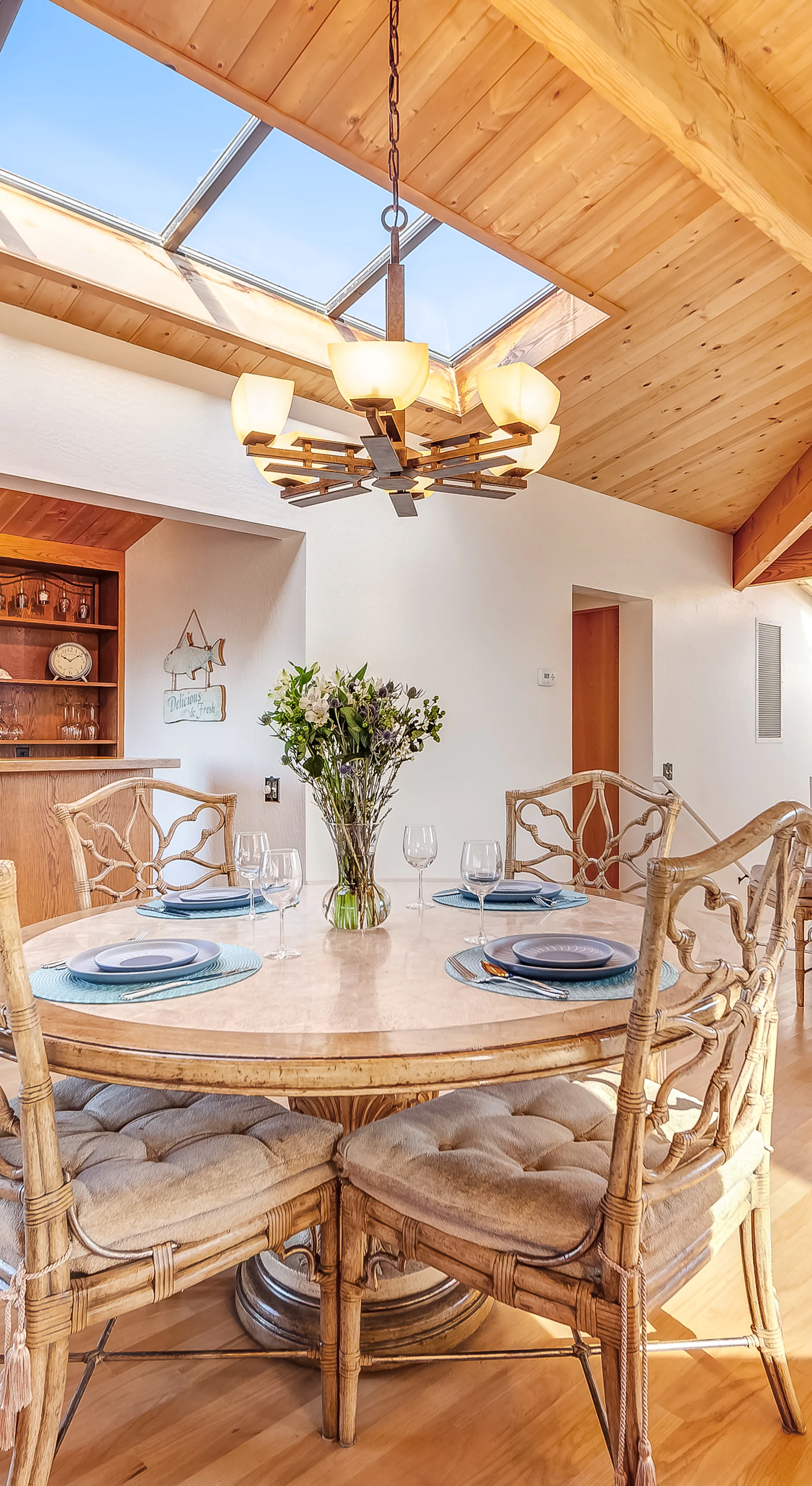 Dine in style beneath the skylights, where natural light complements your meals and ocean views create an unforgettable dining experience.