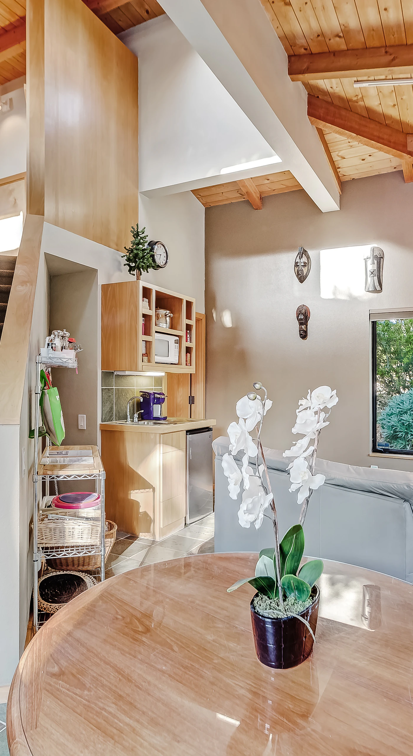 Ascend the staircase to discover a cozy living space that invites relaxation and connection with loved ones.