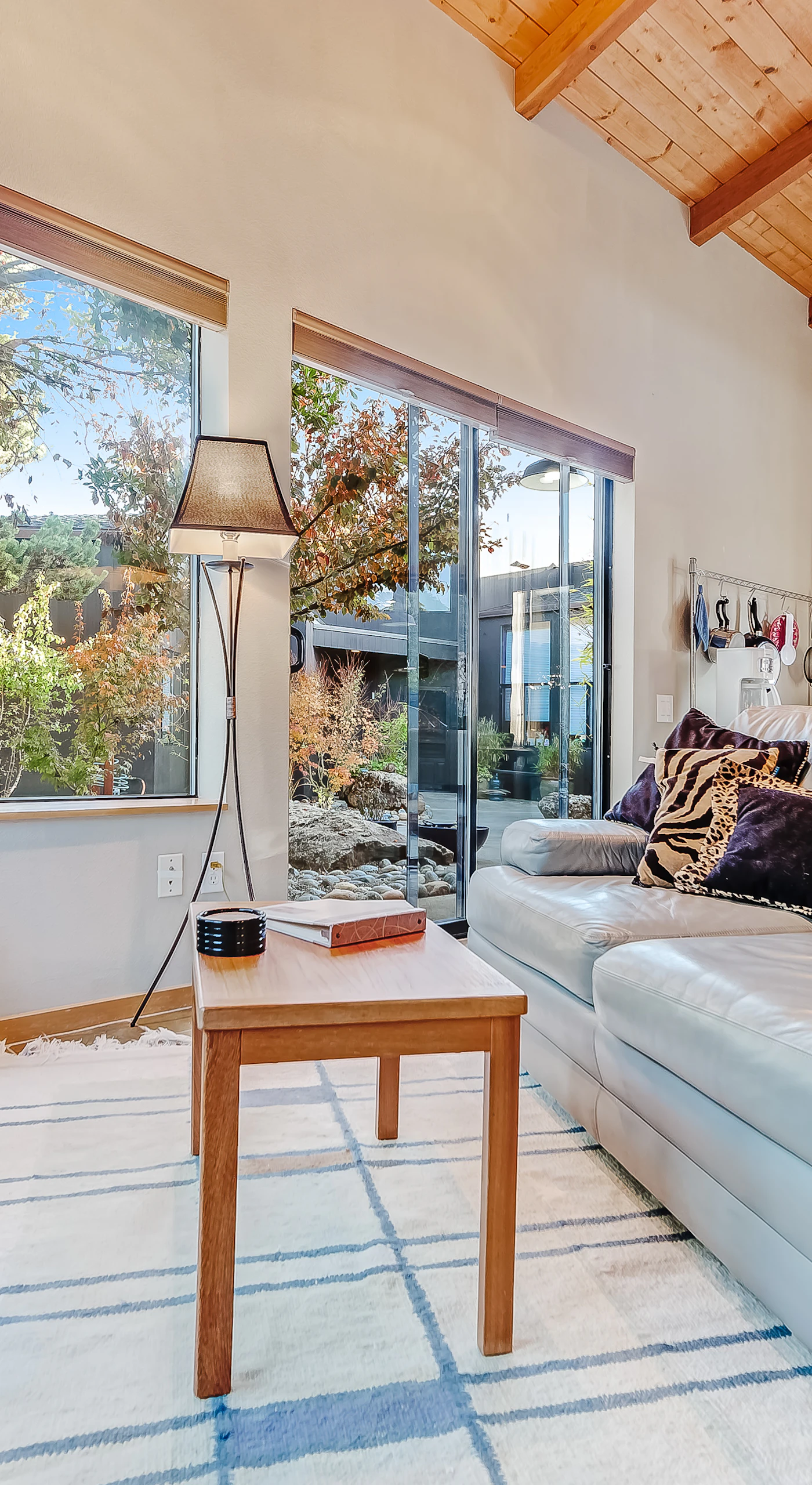Cozy up by the gas fireplace as natural light pours into the living room, creating a warm and inviting space.