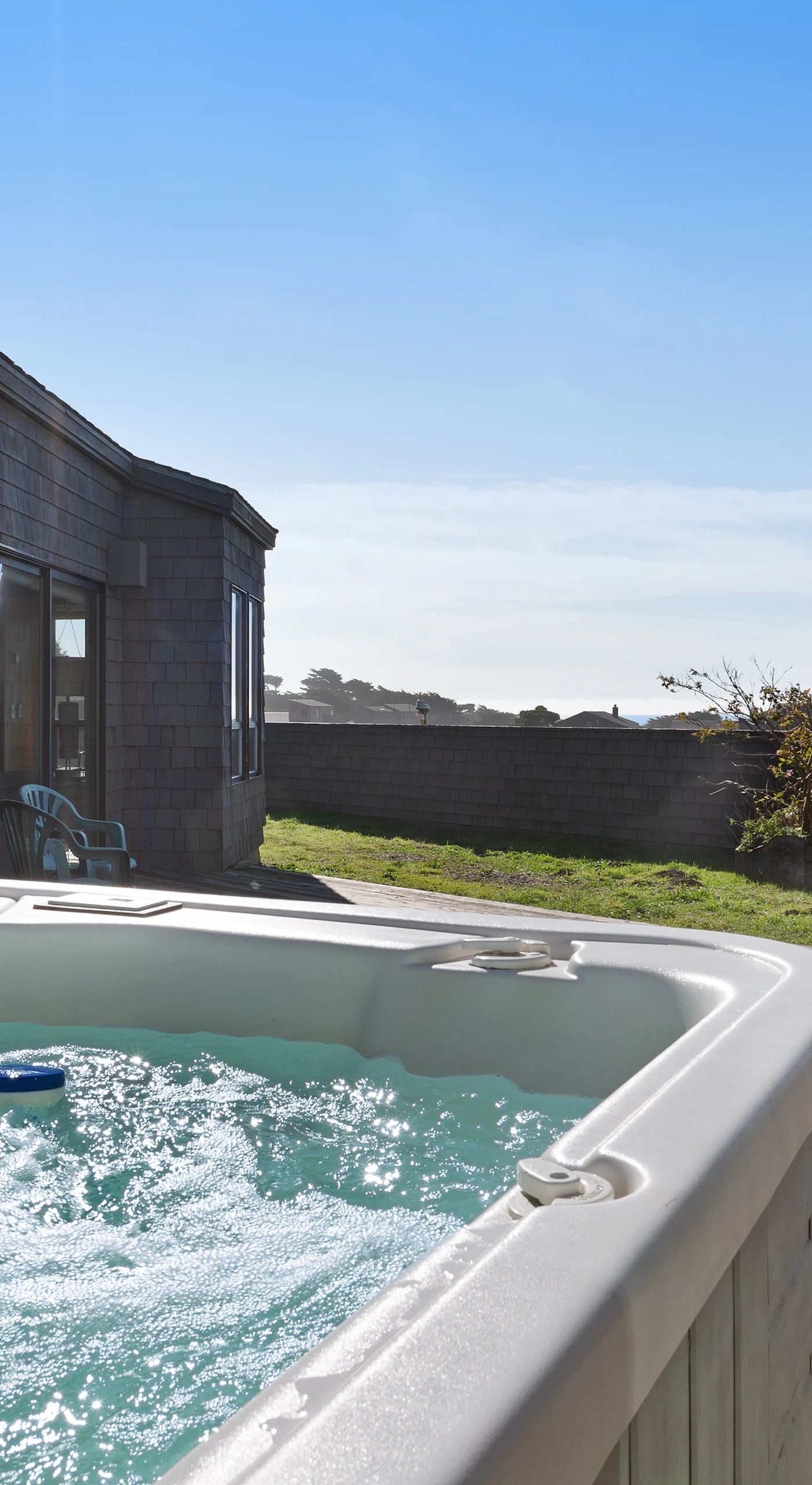 Soak in your private hot tub while enjoying breathtaking ocean views—perfect for unwinding after a day of exploring.