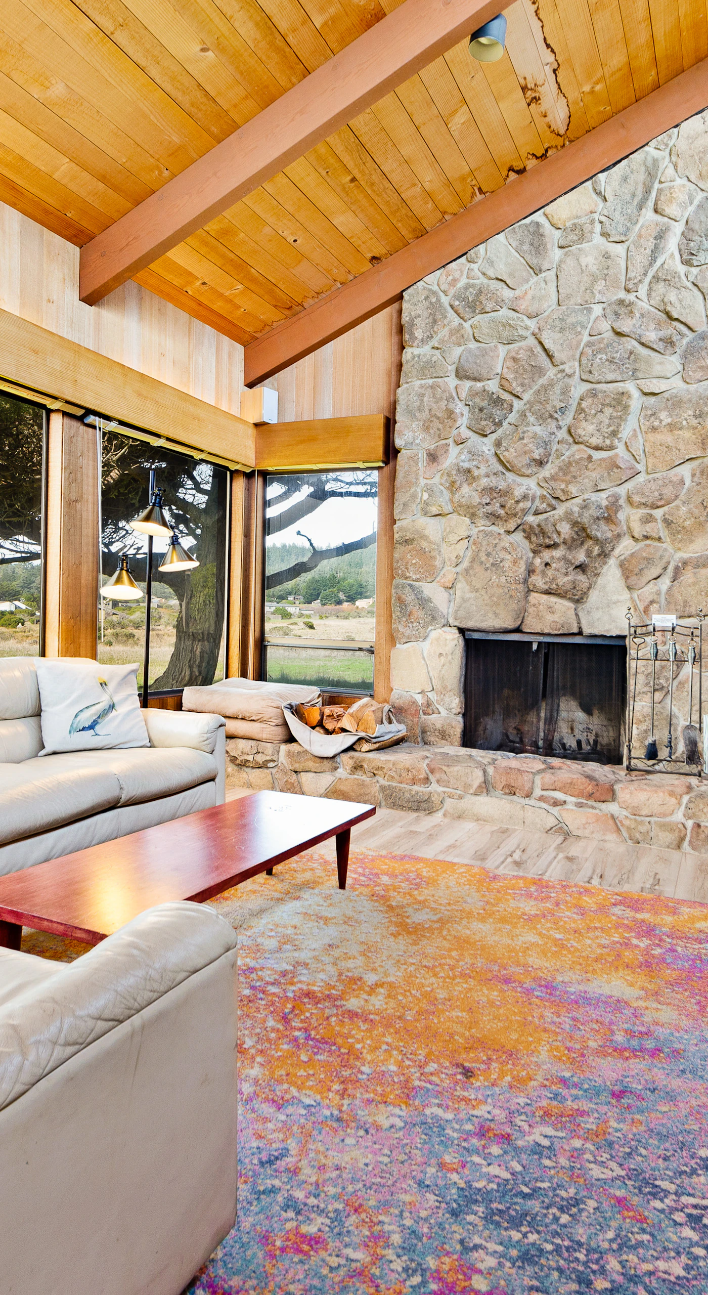 Cozy up by the wood-burning fireplace in this beautifully designed living space, perfect for creating lasting memories after a day of adventure.