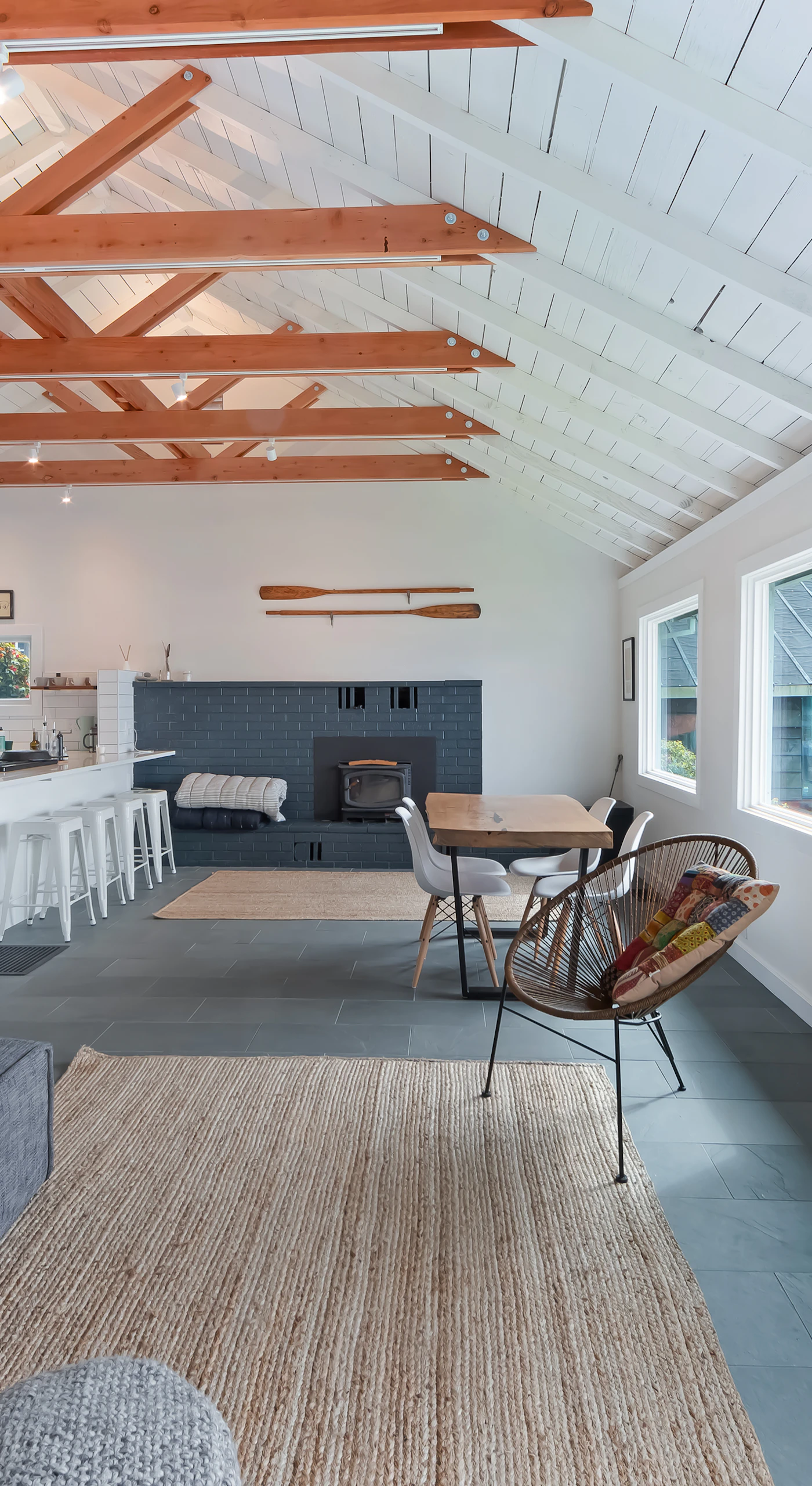 Bright open-concept living flows from the cozy lounge through to your dining area, all under stunning exposed beam ceilings.