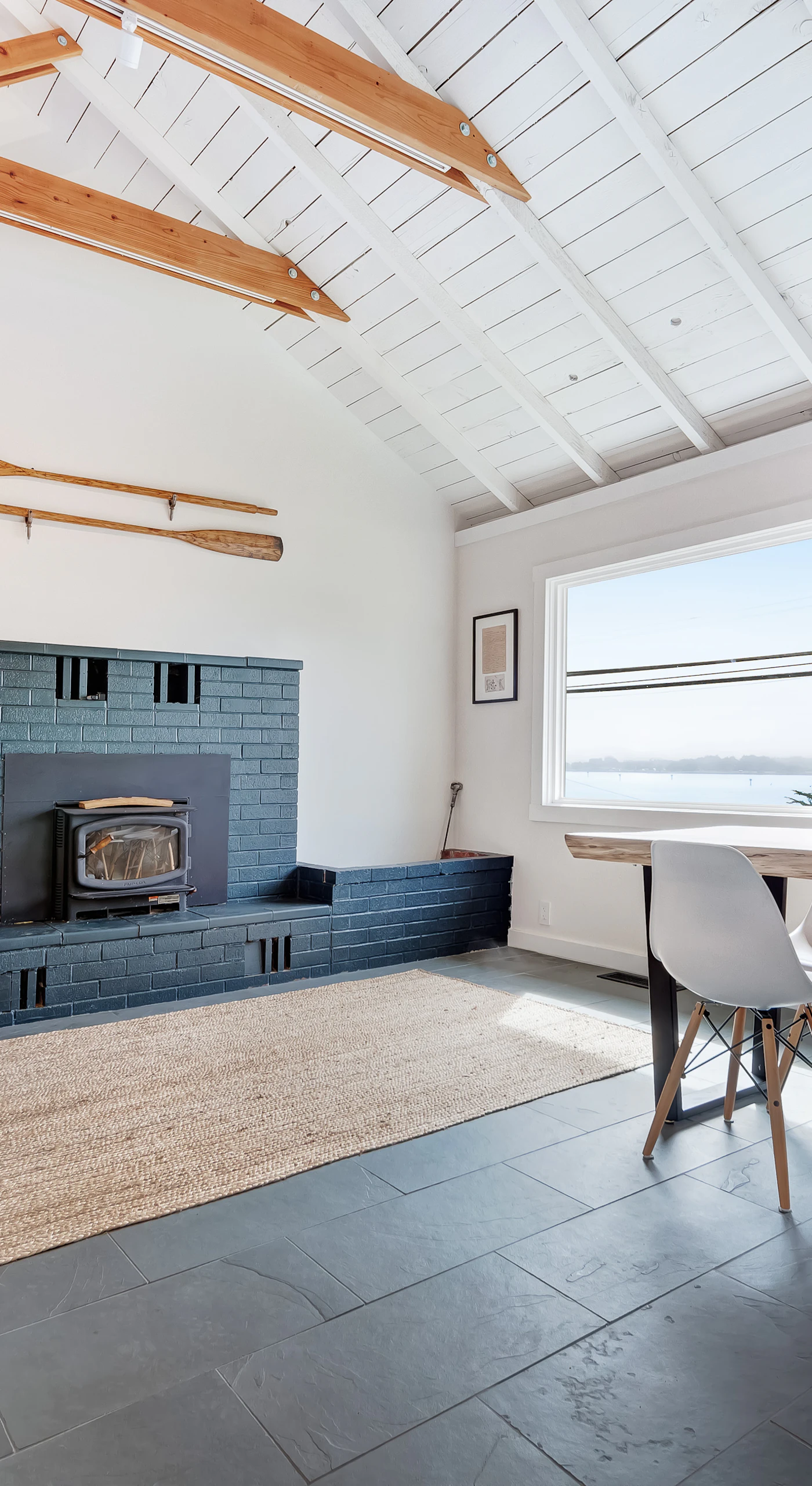 Savor Bodega Bay views through the picture window while dining beside the blue-tiled fireplace surround.