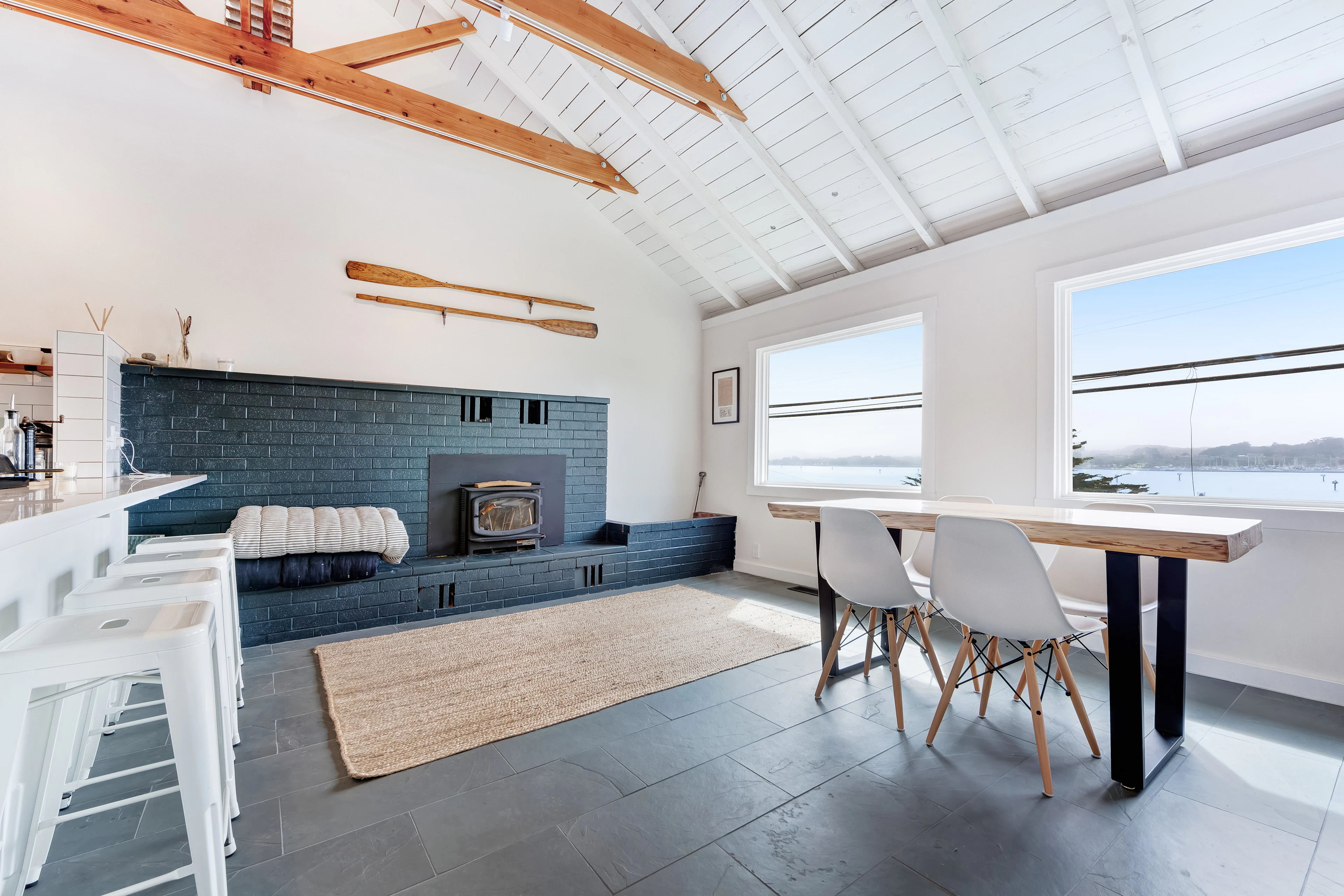 Savor Bodega Bay views through the picture window while dining beside the blue-tiled fireplace surround.