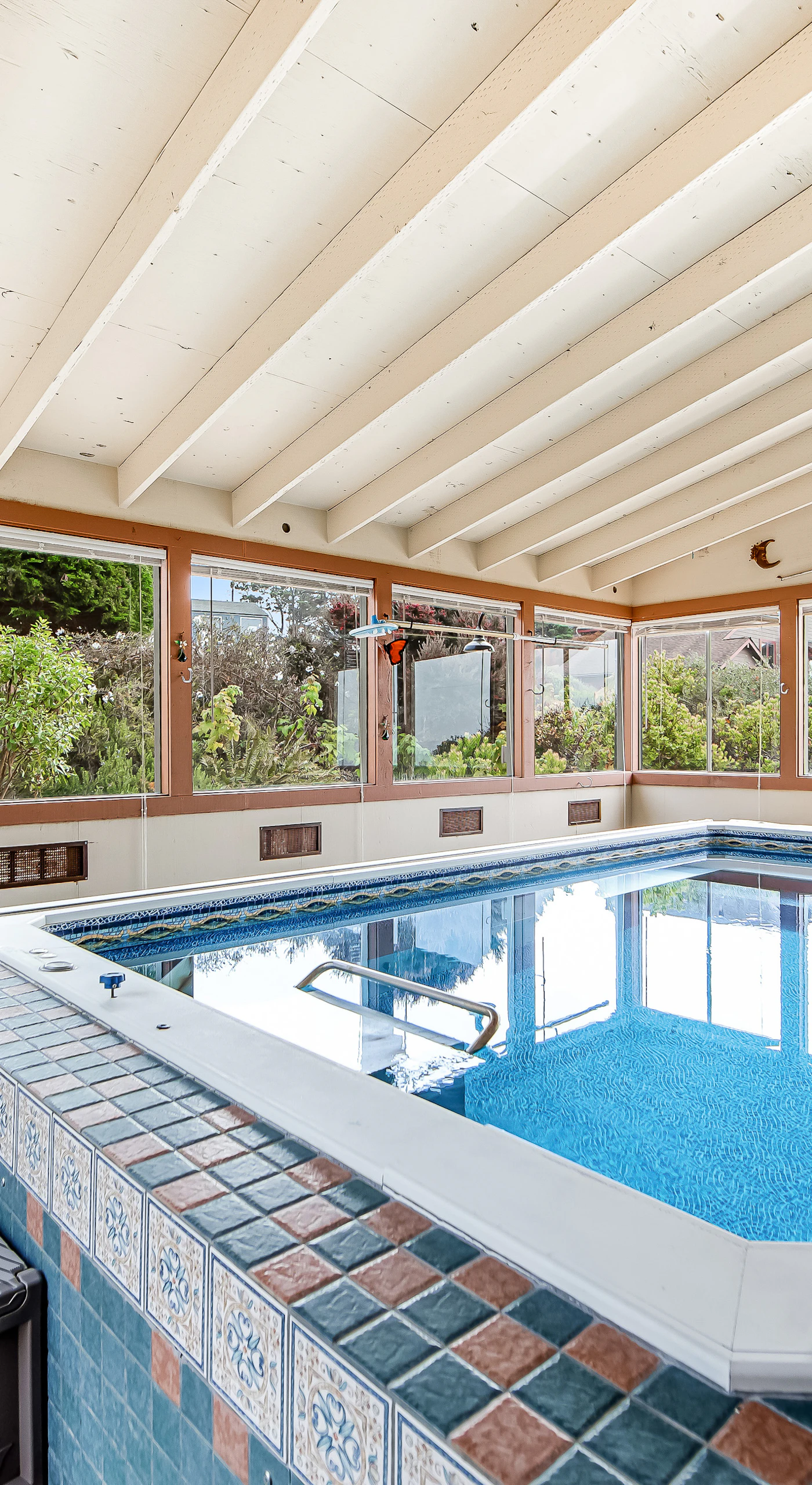 Enter this serene indoor pool, where relaxation meets breathtaking views, perfect for a swim any time.