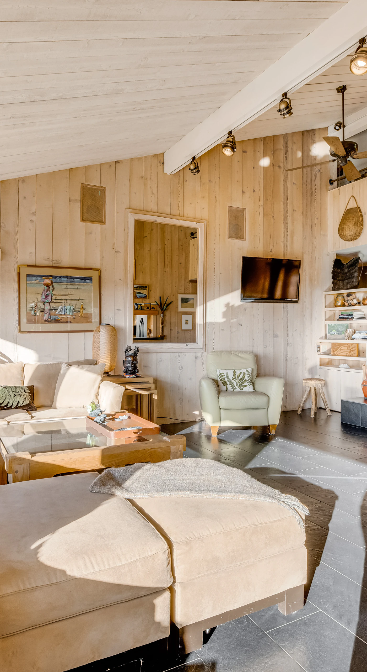 Gather around the cozy fireplace in the bright living room, where ocean views and inviting decor create the perfect space for relaxation.