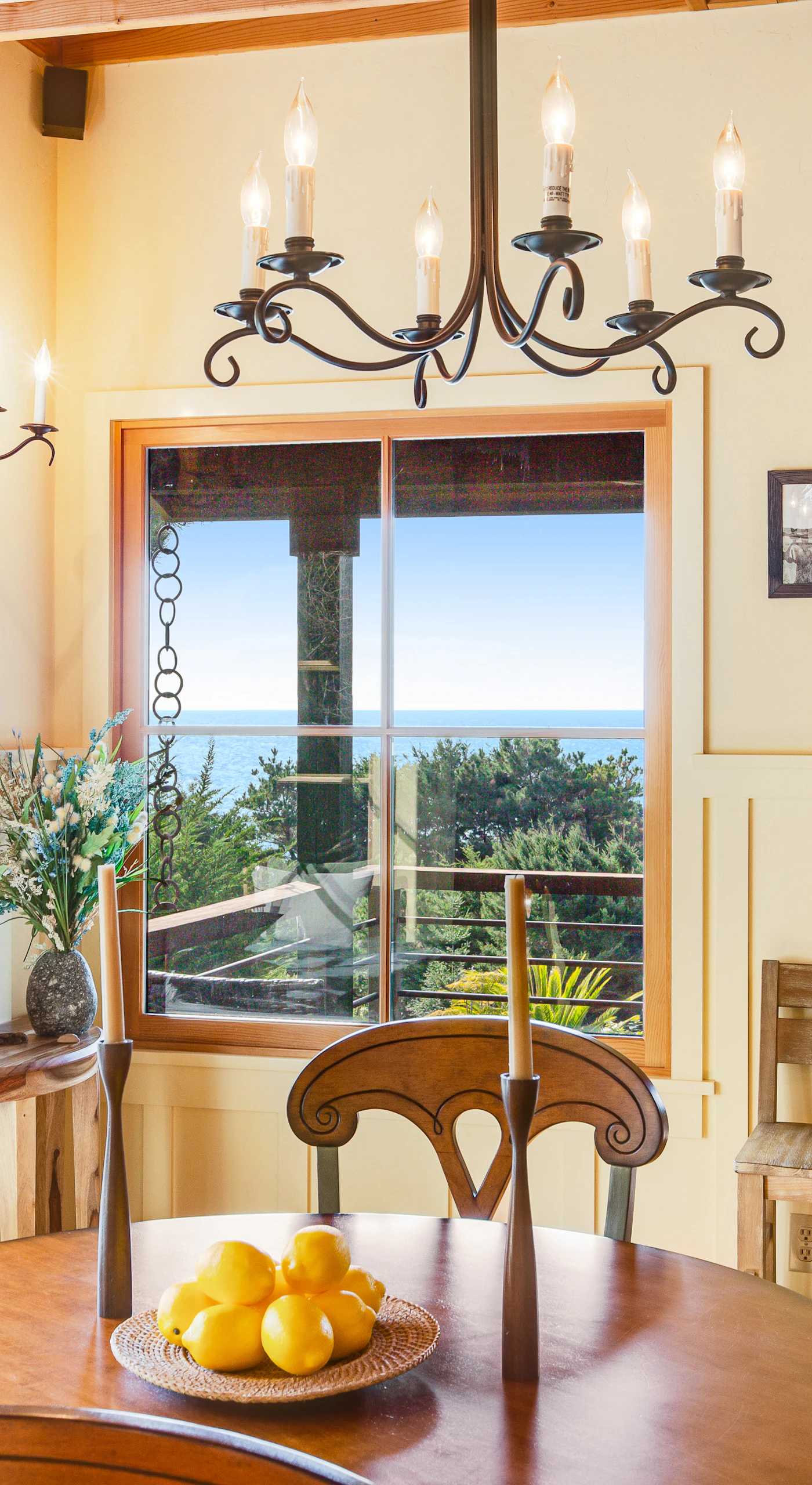 Imagine sipping your morning coffee at this charming dining table, framed by stunning coastal views.