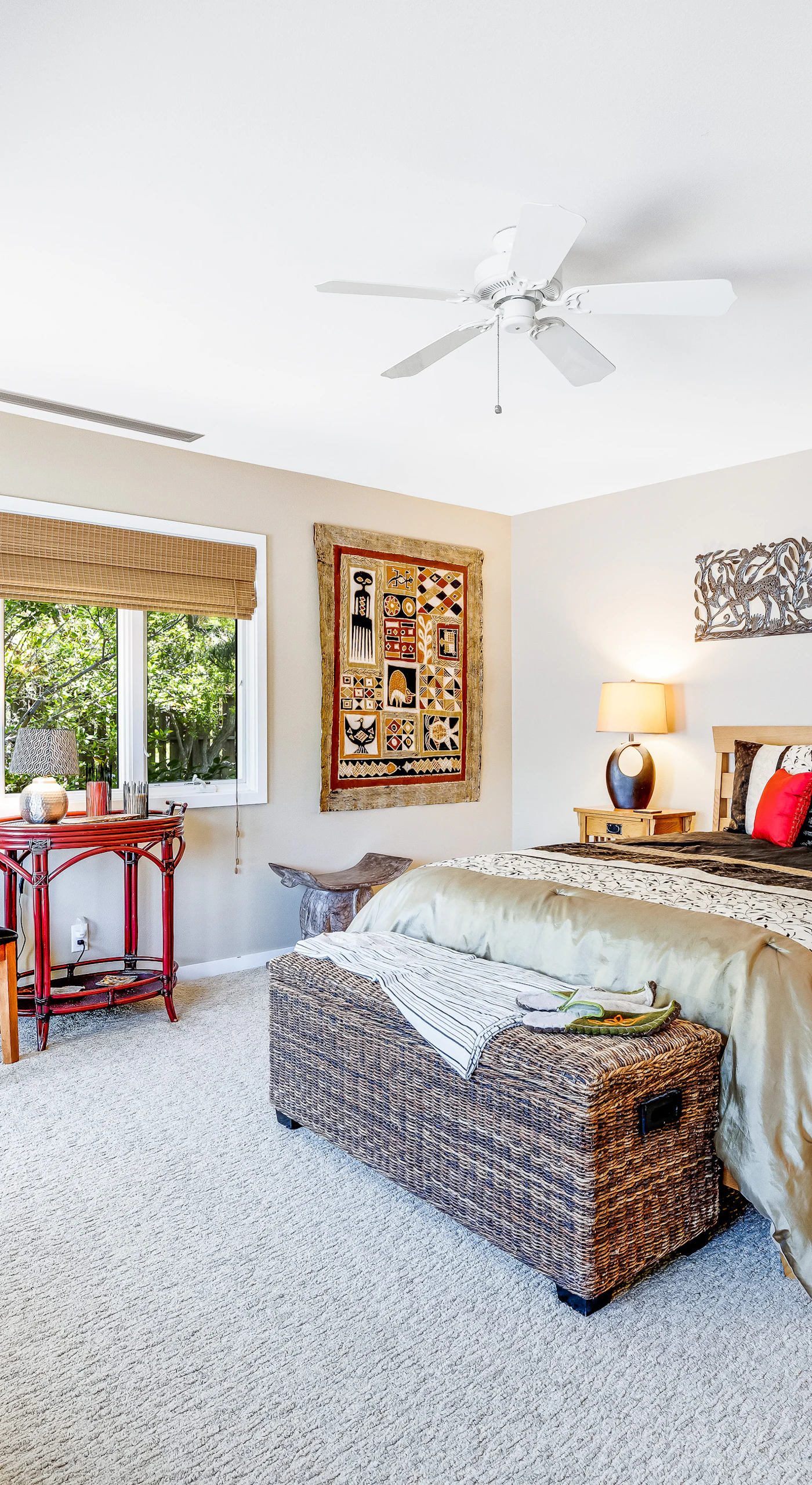 This inviting master bedroom invites you to relax with its tasteful decor and cozy reading nook, perfect for unwinding after a long day.