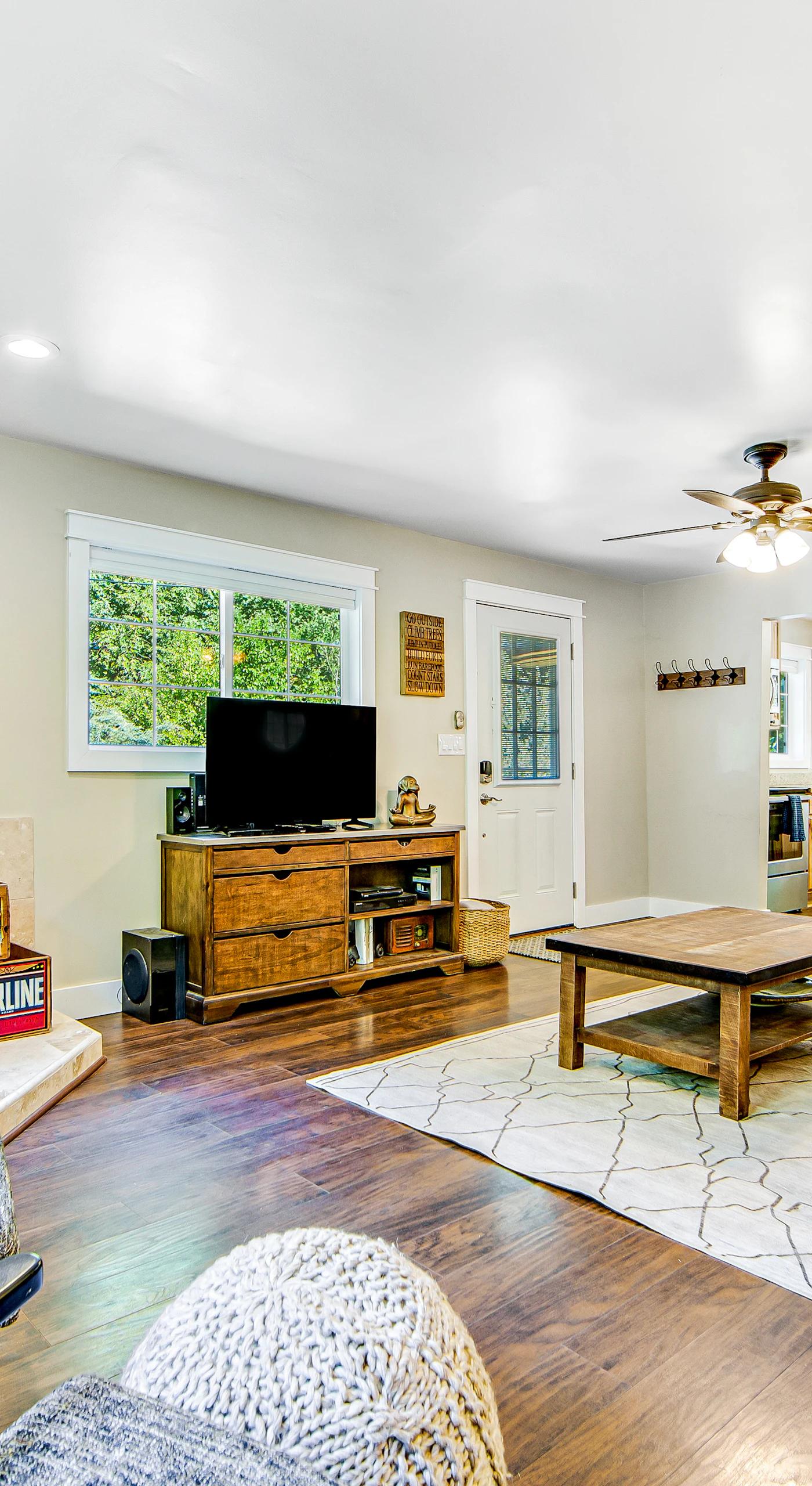 Gather around the wood-burning stove after a day exploring Forestville wineries — your cozy wine country living room awaits