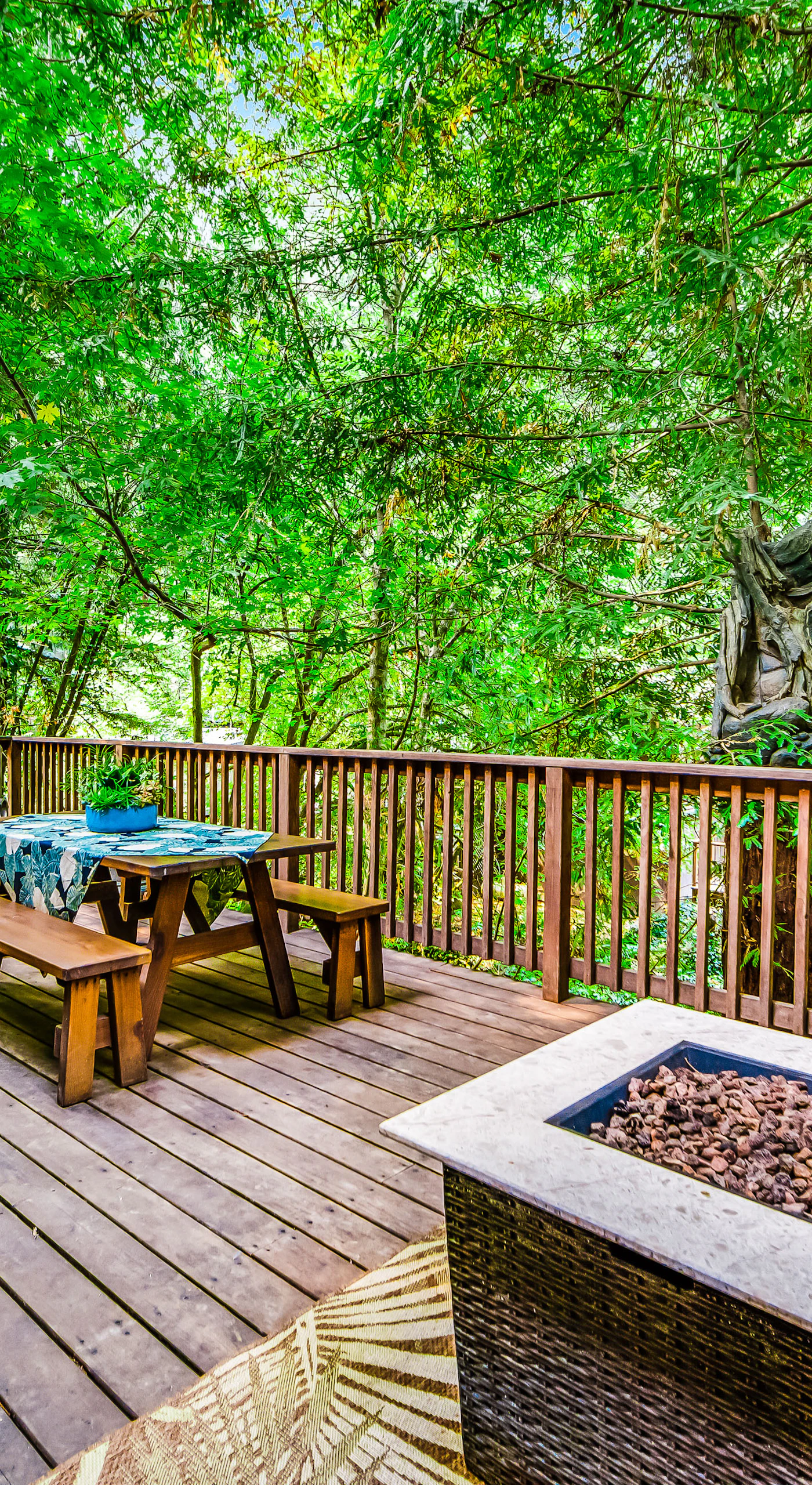 Dine under the redwoods at your picnic table, then pull up a chair by the fire pit — your outdoor living room is wrapped in Sonoma wine country's ancient forest.