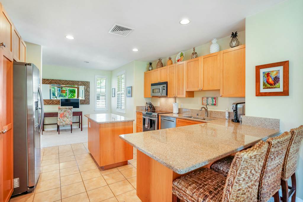Fully equipped kitchen with island seating and modern appliances