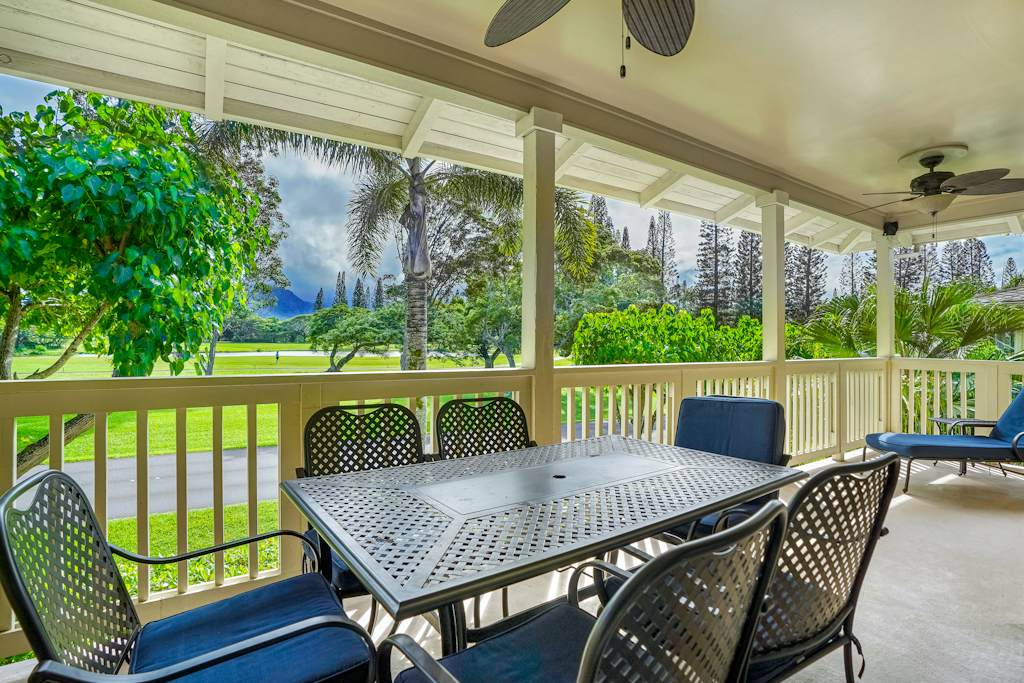 Covered porch with outdoor dining table, perfect for morning coffee