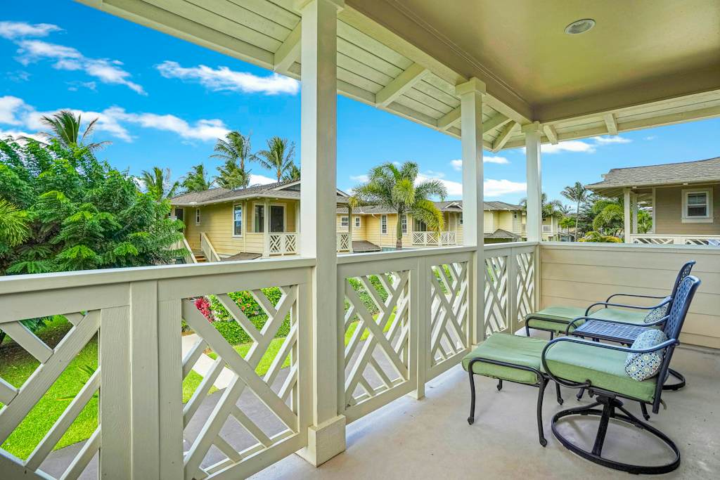 Screened lanai with rocking chairs, ideal for relaxing outdoors