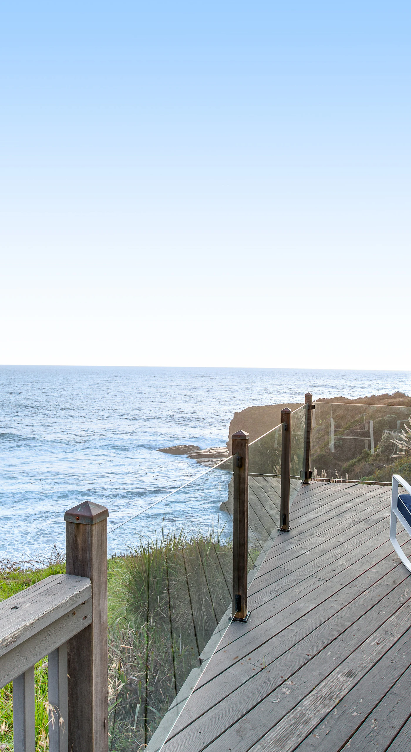 Breathe in the salty air from your private deck, where expansive ocean views set the stage for peaceful mornings and sunset reflections.