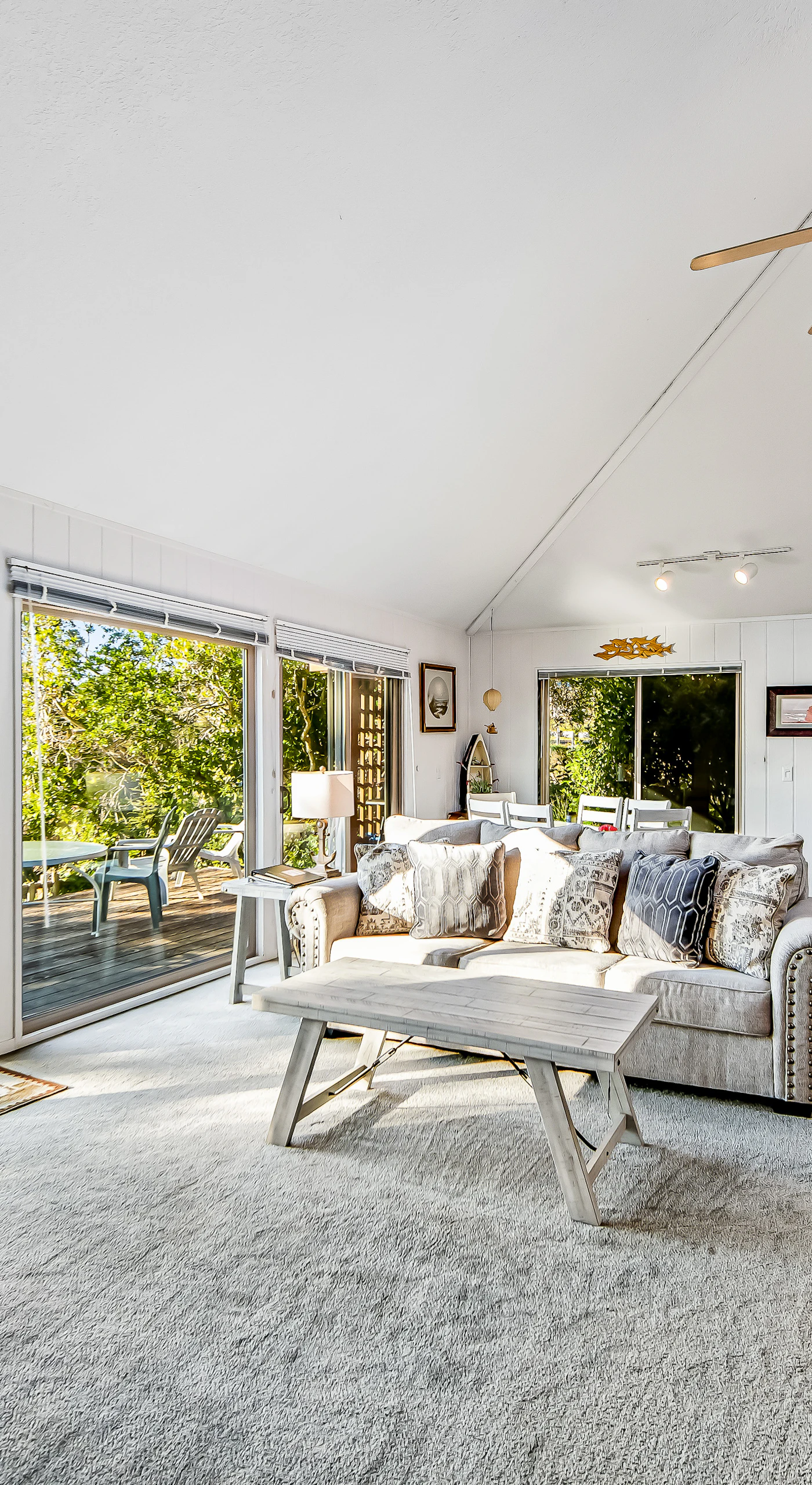 Morning light fills this spacious living room, creating an inviting space for relaxation and ocean-inspired tranquility.