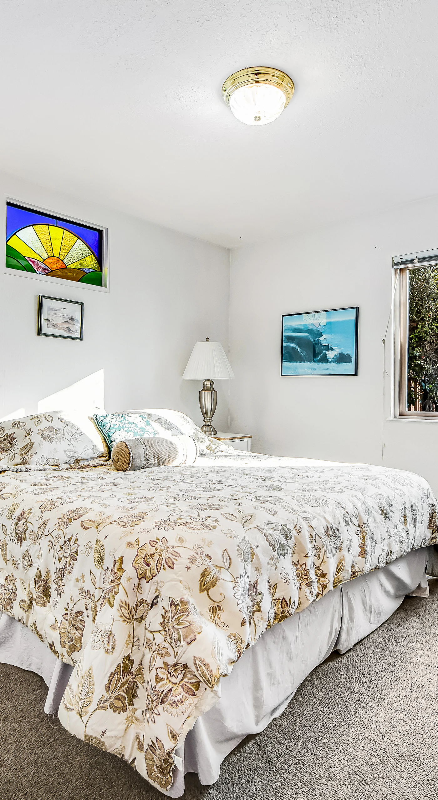 The tranquil master bedroom offers a peaceful retreat, with soft linens and natural light creating an inviting atmosphere.