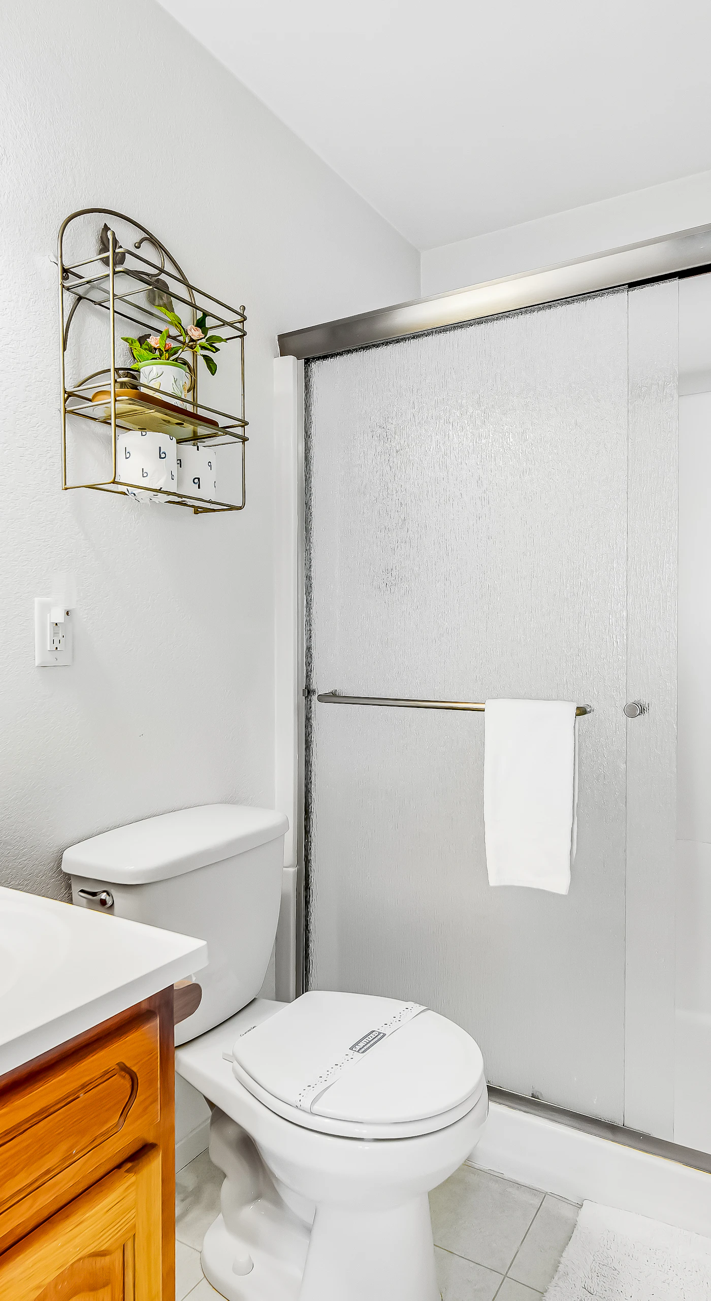 The bathroom features modern fixtures and a clean design, providing a refreshing space to prepare for your coastal adventures.