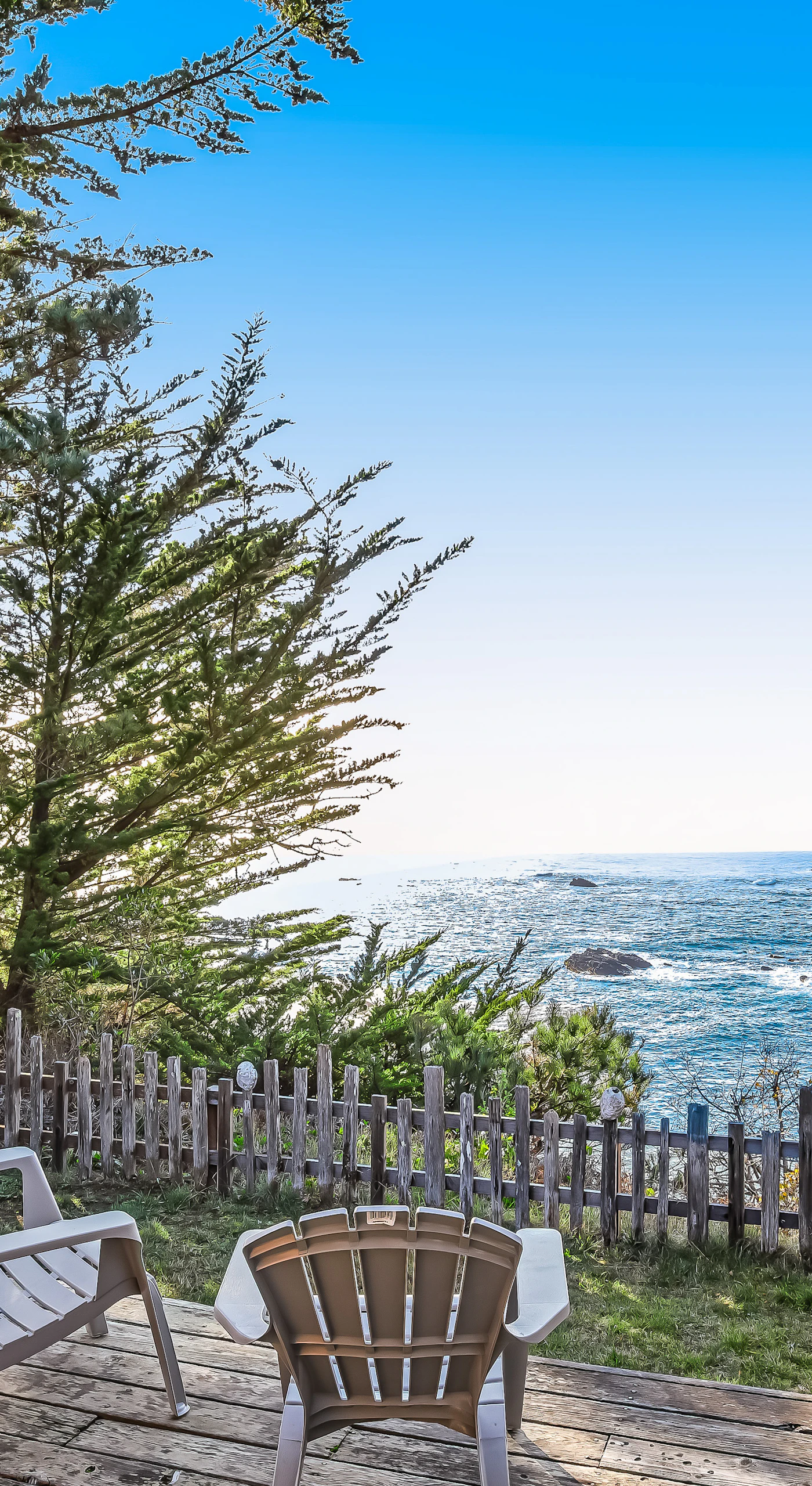 Nestled among the trees, your private hot tub offers a tranquil escape, where you can unwind while gazing at the stunning ocean scenery.