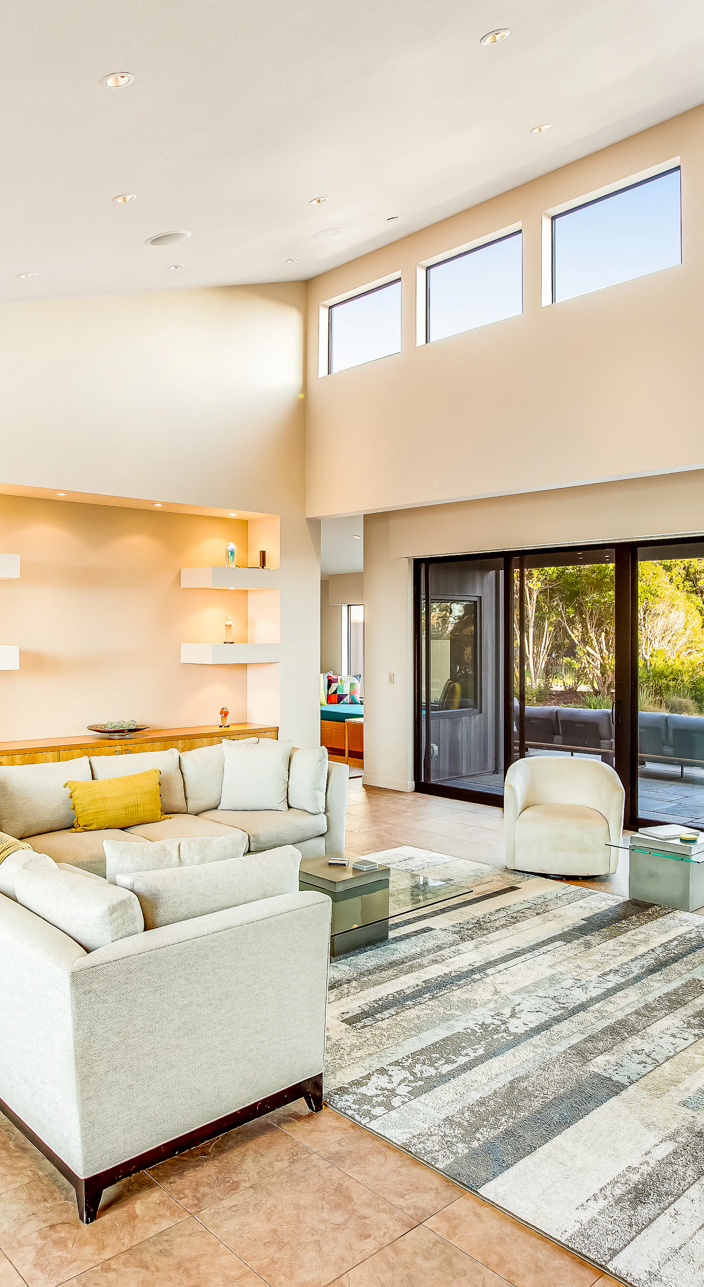 Morning light fills the space, inviting you to sip your coffee while soaking in the stunning coastal views right from your sofa.