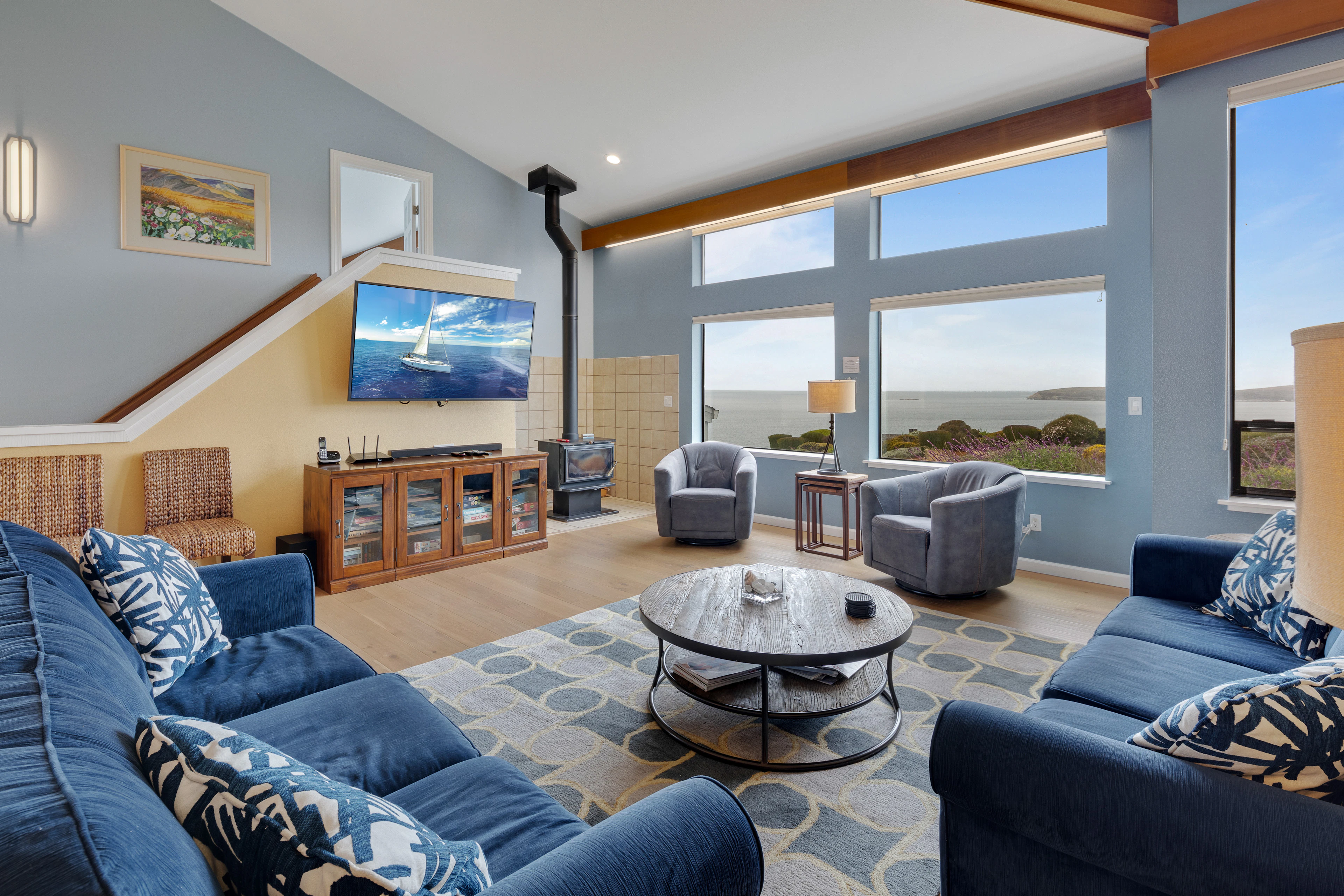 Sink into plush seating and take in sweeping Bodega Bay views from your vaulted great room — the perfect base after a Sonoma Coast wine trail.