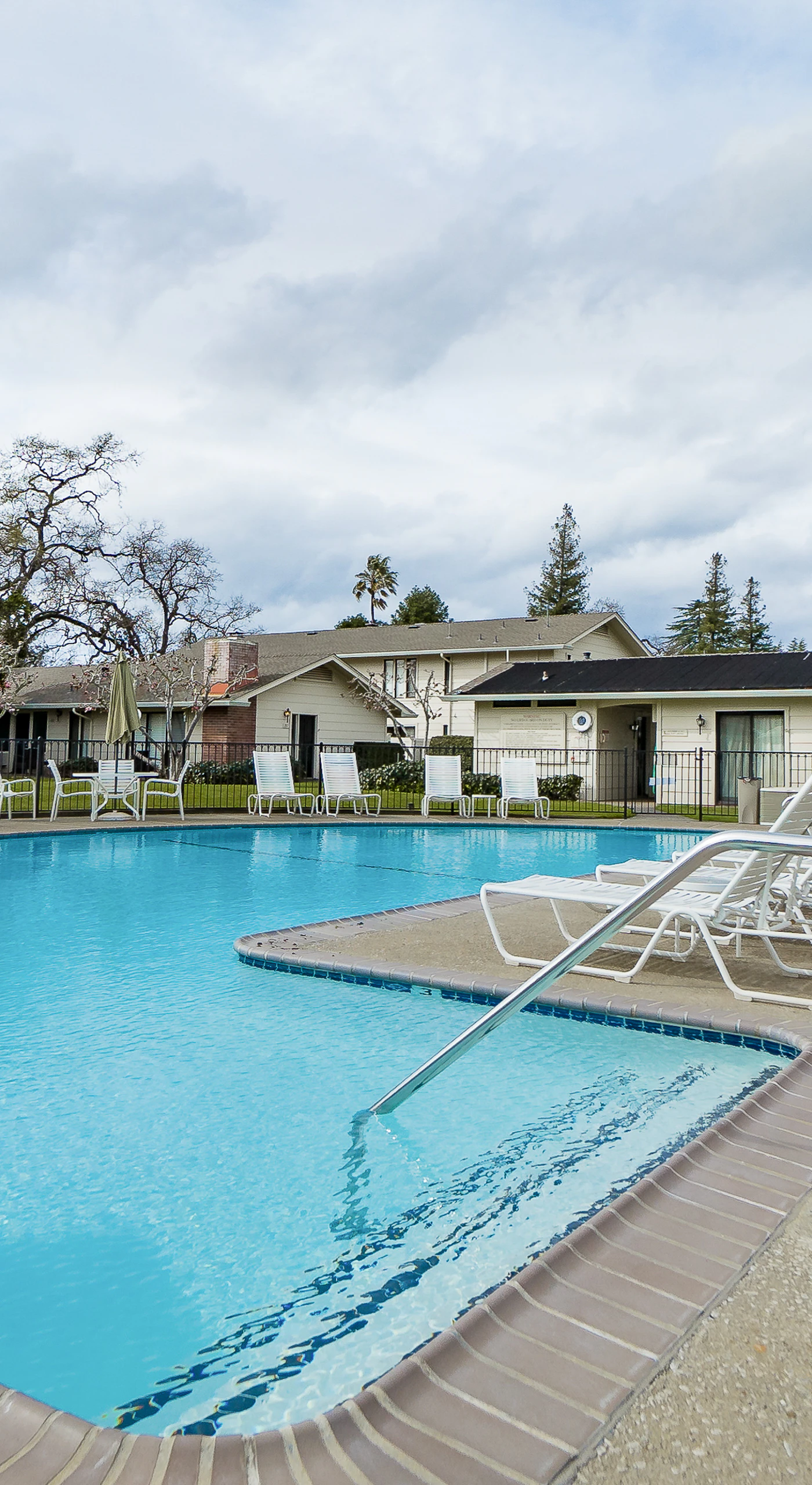 Take a refreshing dip in your resort's sparkling communal pool, surrounded by lounge chairs and Napa Valley sunshine — steps from your front door.