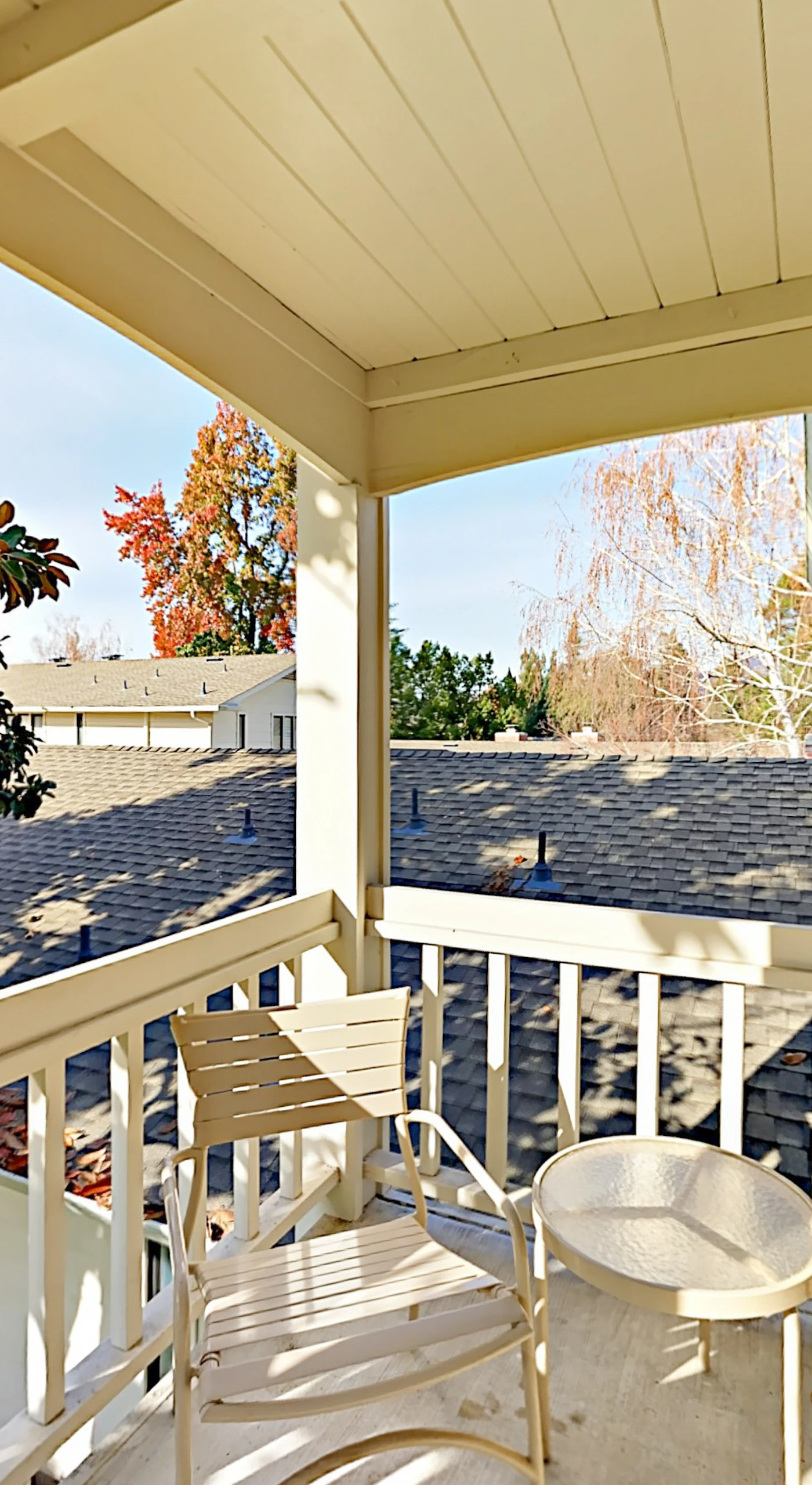 Sip your morning coffee on the covered deck surrounded by mature trees and peaceful resort views at Silverado in Napa wine country