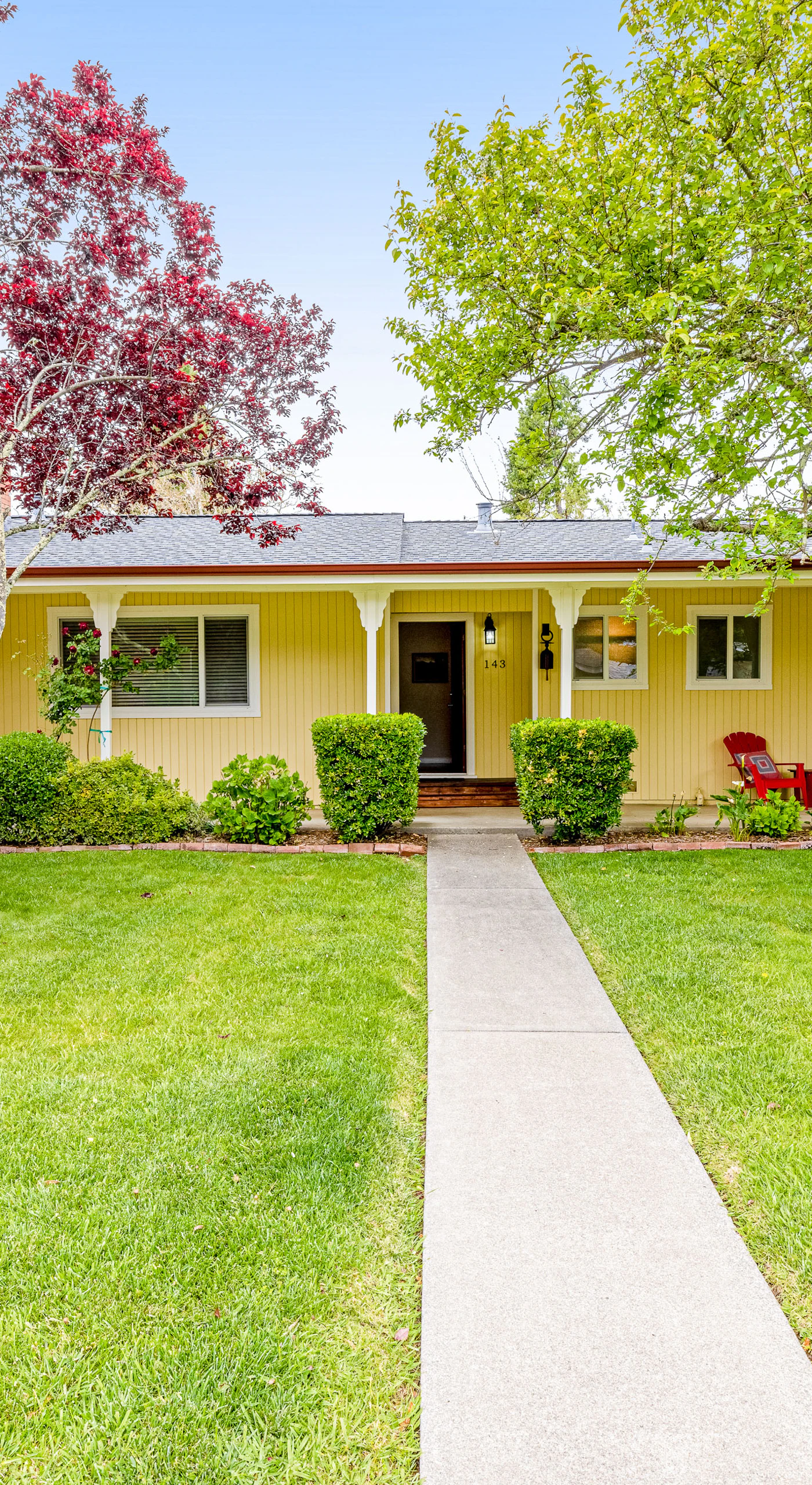 Welcome to your Kenwood wine country escape — a charming yellow ranch nestled among flowering trees and manicured gardens, steps from Sonoma Valley tasting rooms.