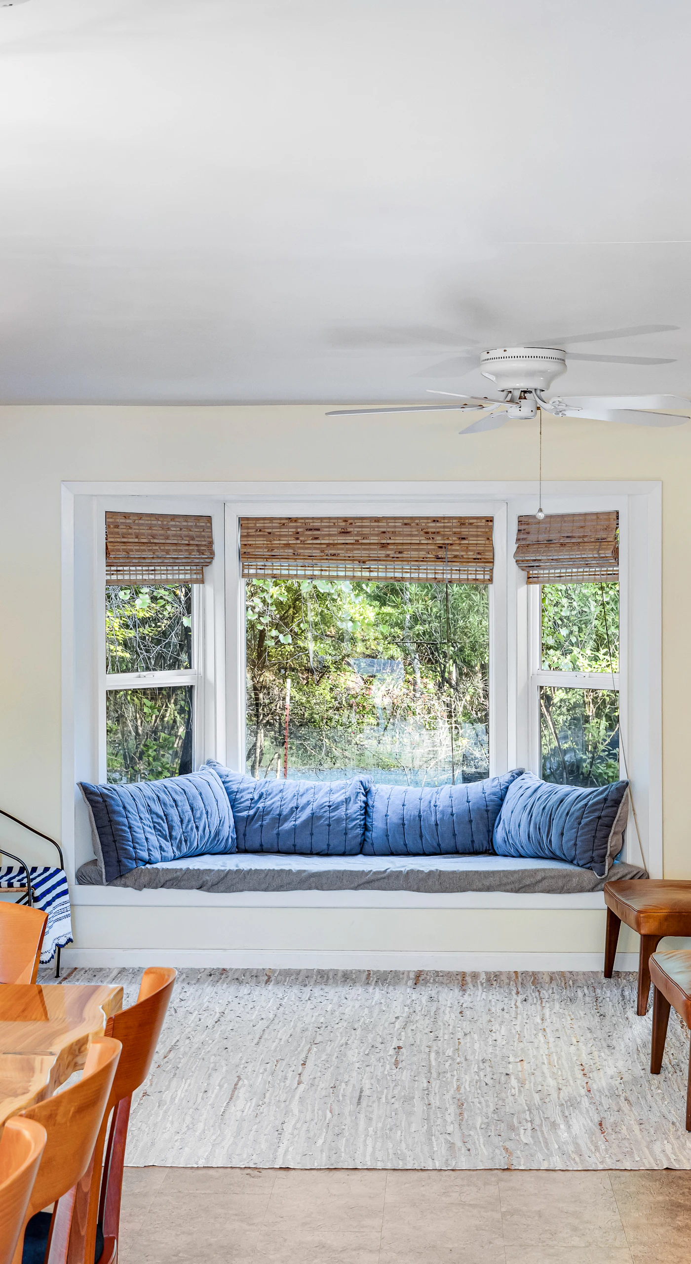 Relax in your airy living space where the cozy window nook and elegant chandelier create the ultimate wine country reading corner