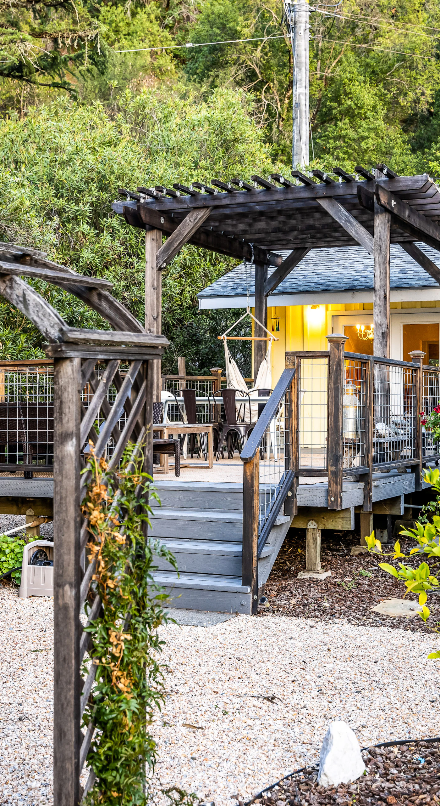 Step through your private vine-draped arbor into a storybook Cloverdale cottage tucked among lush gardens and towering trees