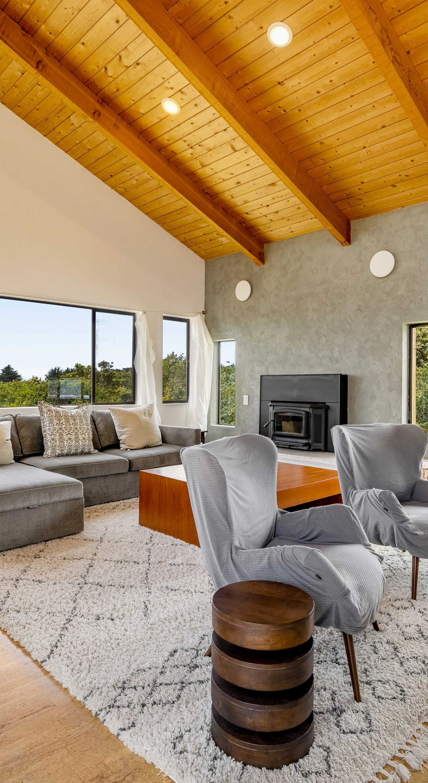 Morning light fills this spacious living room, inviting you to relax with a good book while the ocean view sets the perfect backdrop.