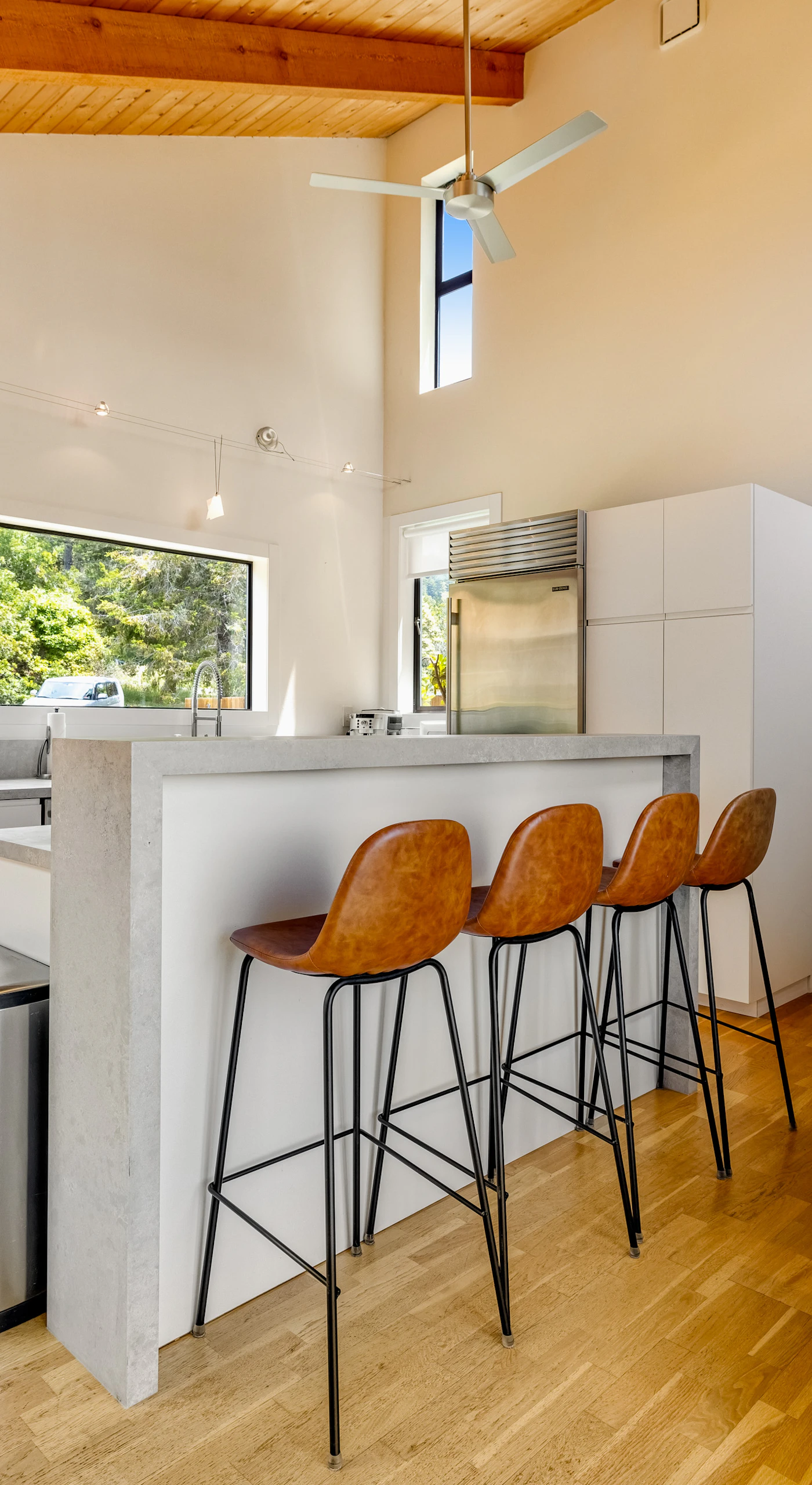 Cook up culinary delights in this modern kitchen, where sleek design meets functionality, allowing you to create memorable meals.