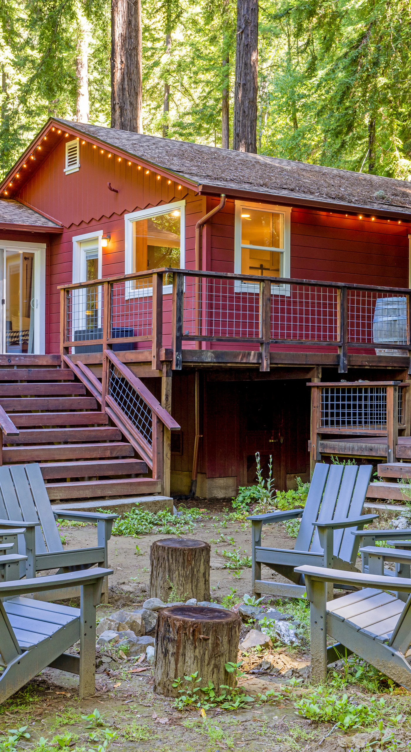 Step off your rear deck into a private redwood grove with Adirondack seating circled around a fire pit — your evening gathering spot under the canopy.