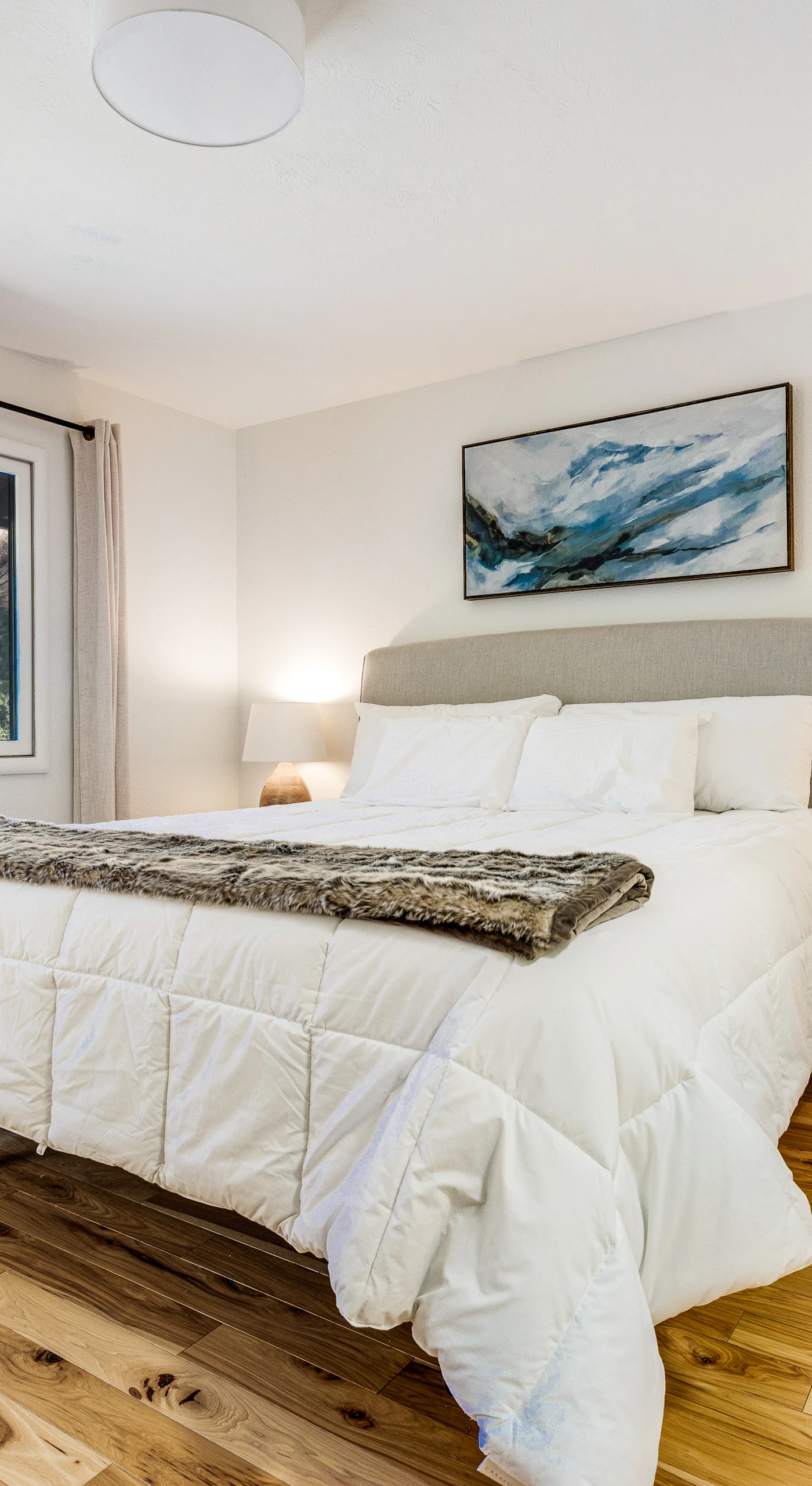 Stretch out in the king-size primary suite with an upholstered headboard, warm hardwood floors, and a luggage bench — your wine country sanctuary.