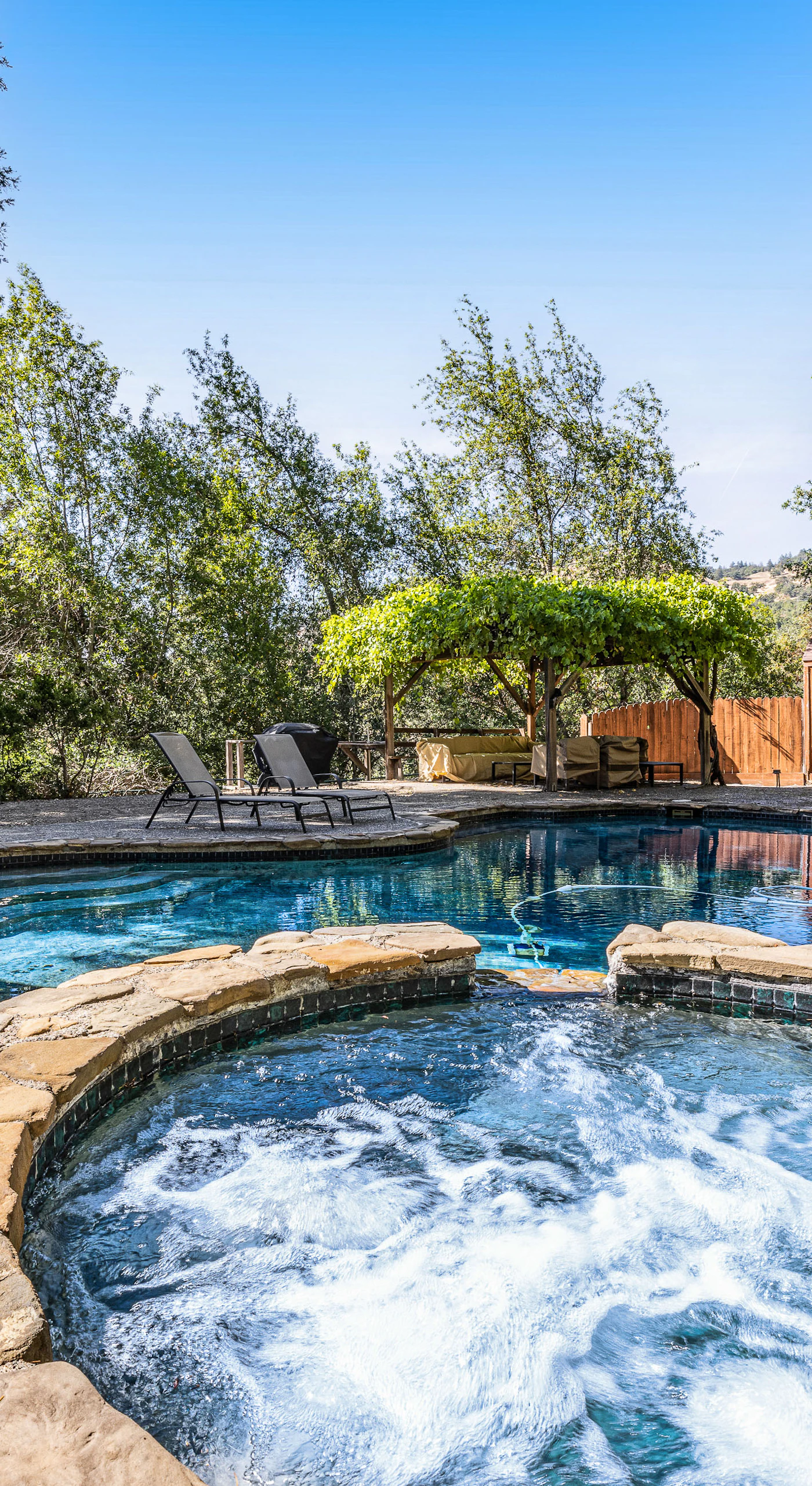 Watch the hot tub jets bubble while your private pool glistens under blue Sonoma County skies — the ultimate wine country cool-down between tastings.