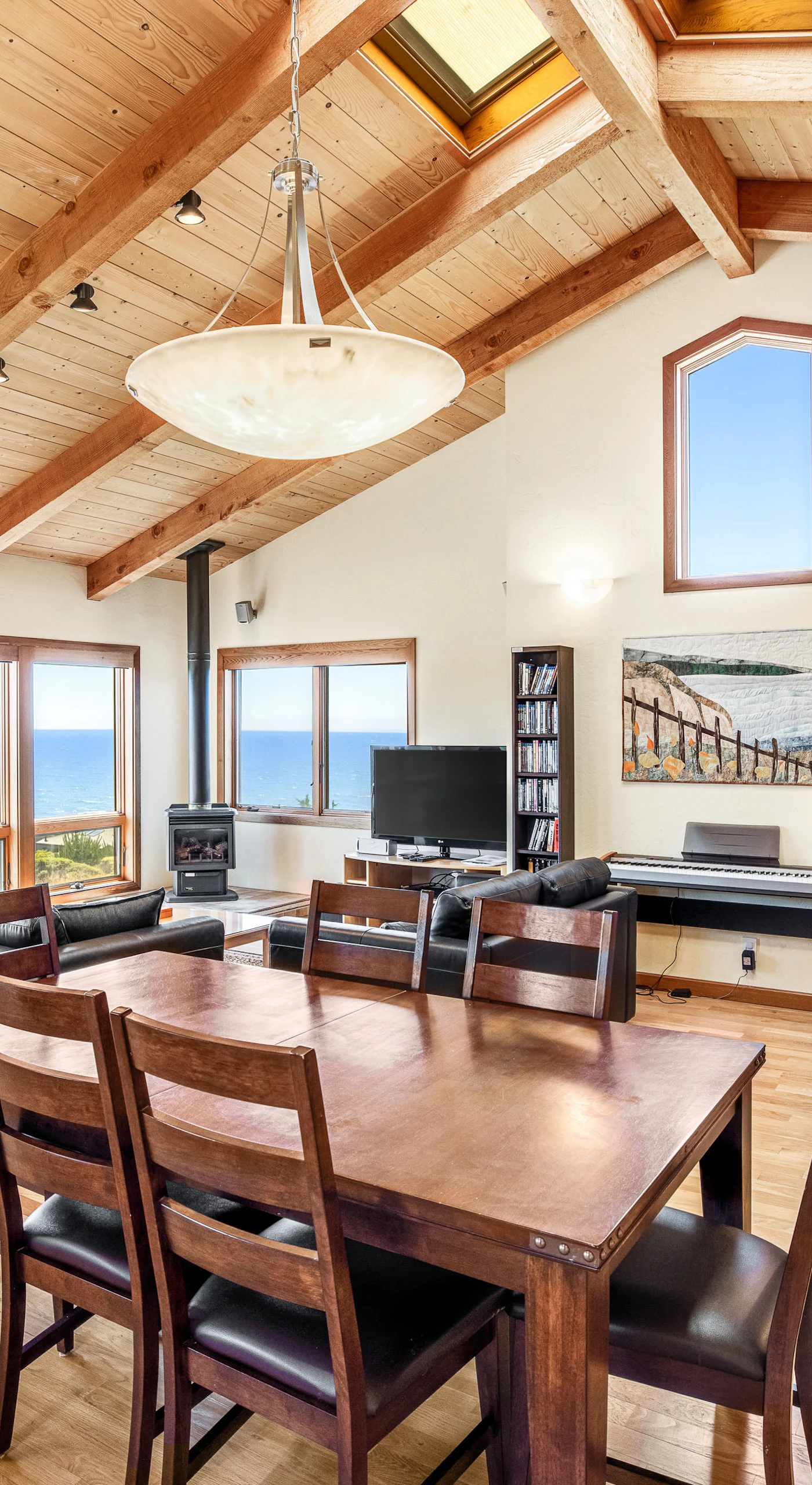 Gather around the dining table, where ocean views and shared meals create unforgettable memories with loved ones.