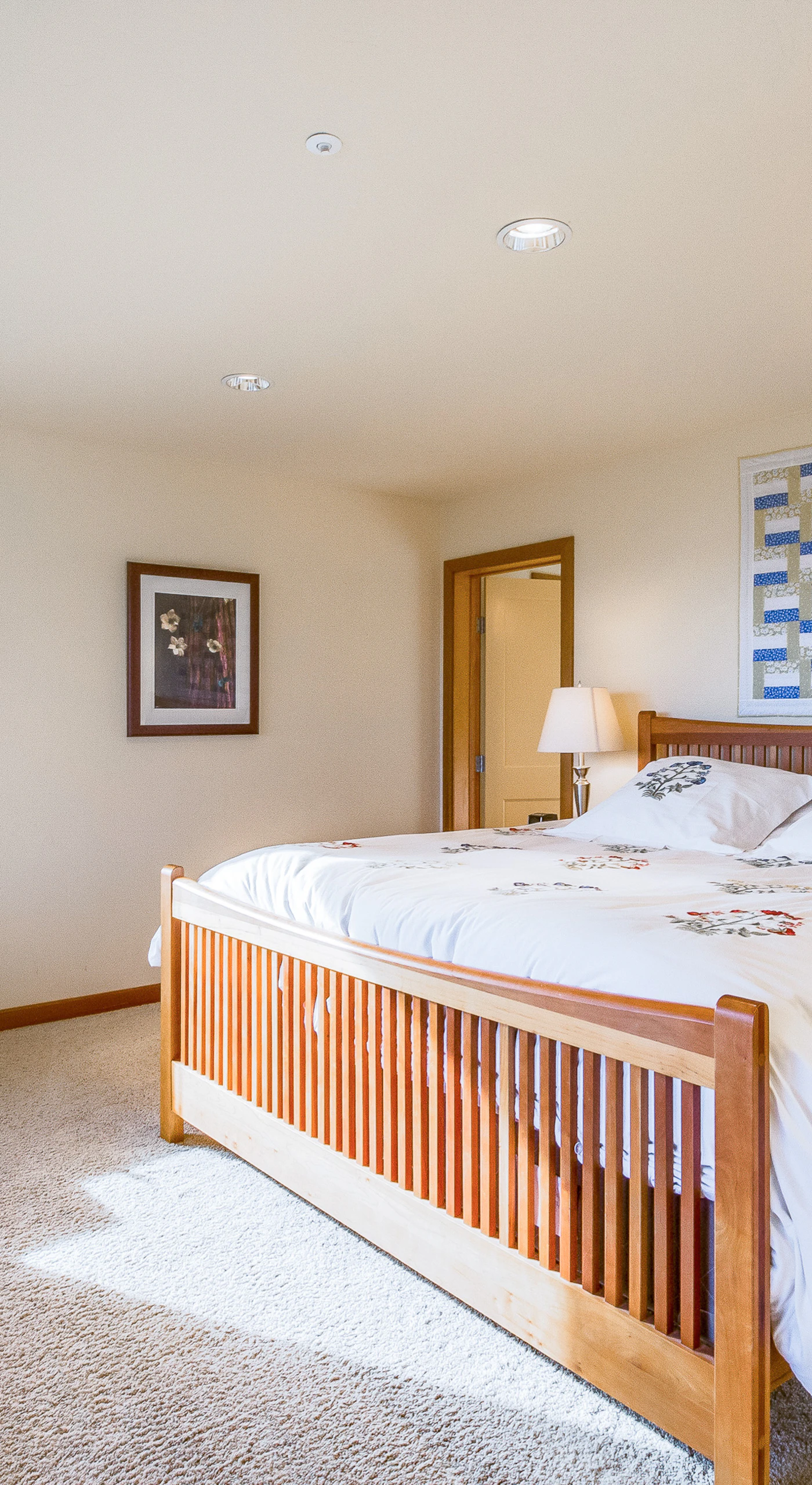 Your master bedroom awaits, a peaceful haven featuring plush bedding and views that invite you to unwind in coastal comfort.
