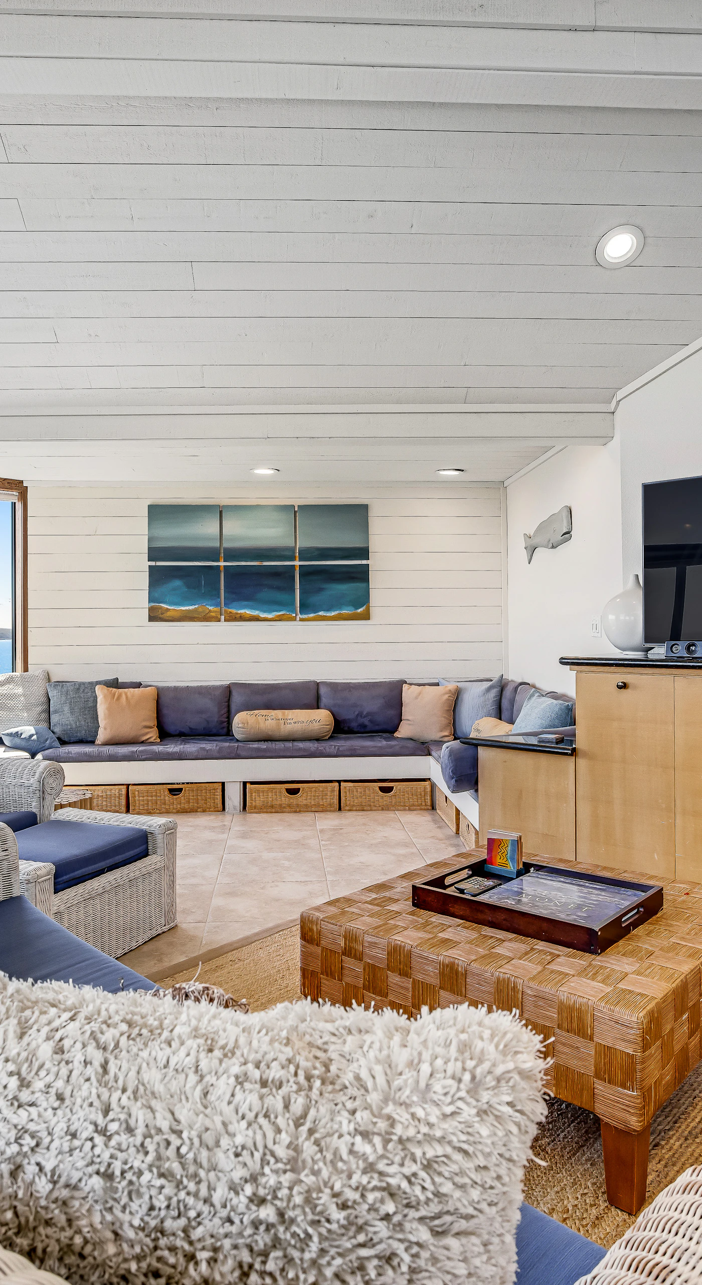 Gather your group around the big-screen TV or simply gaze at the Pacific — your spacious living room delivers both movie nights and ocean magic