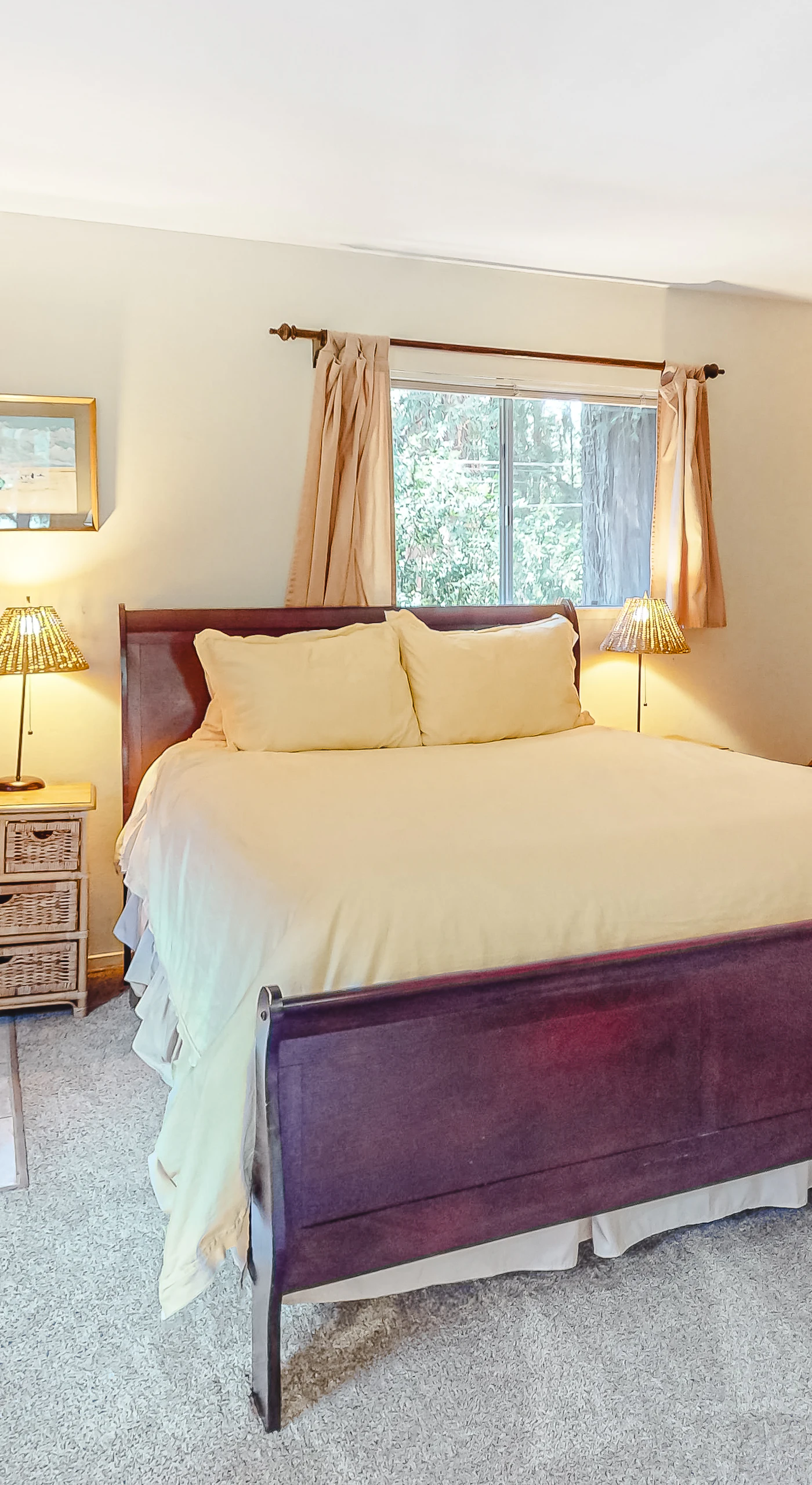 Cozy up beside the wood stove in your lower-level suite — a rich sleigh bed and warm tones make this your private redwood hideaway.