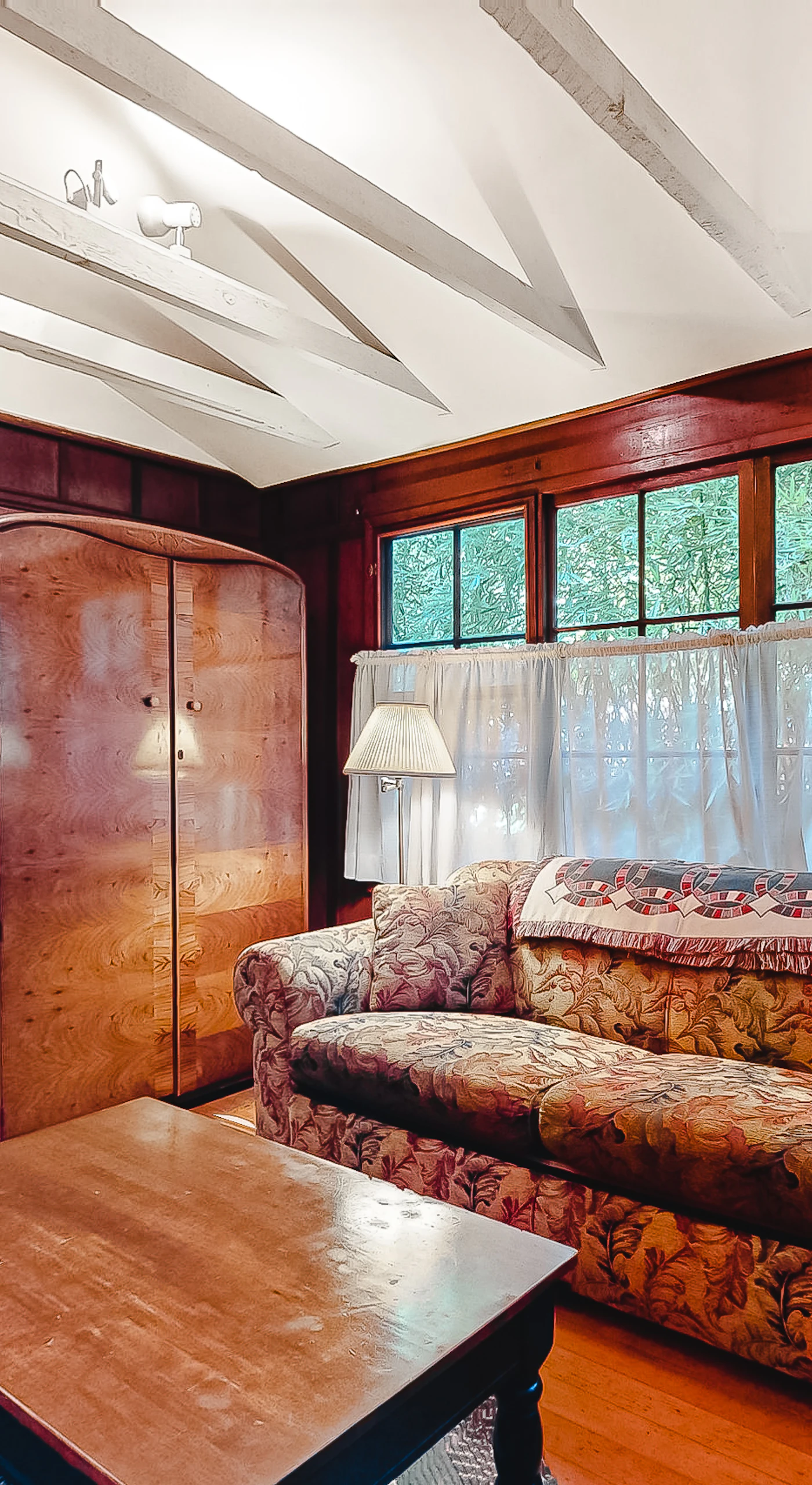 Curl up on the vintage sofa with a local wine — your living room's warm wood walls and soft lamplight make every evening feel like a Sonoma County escape.
