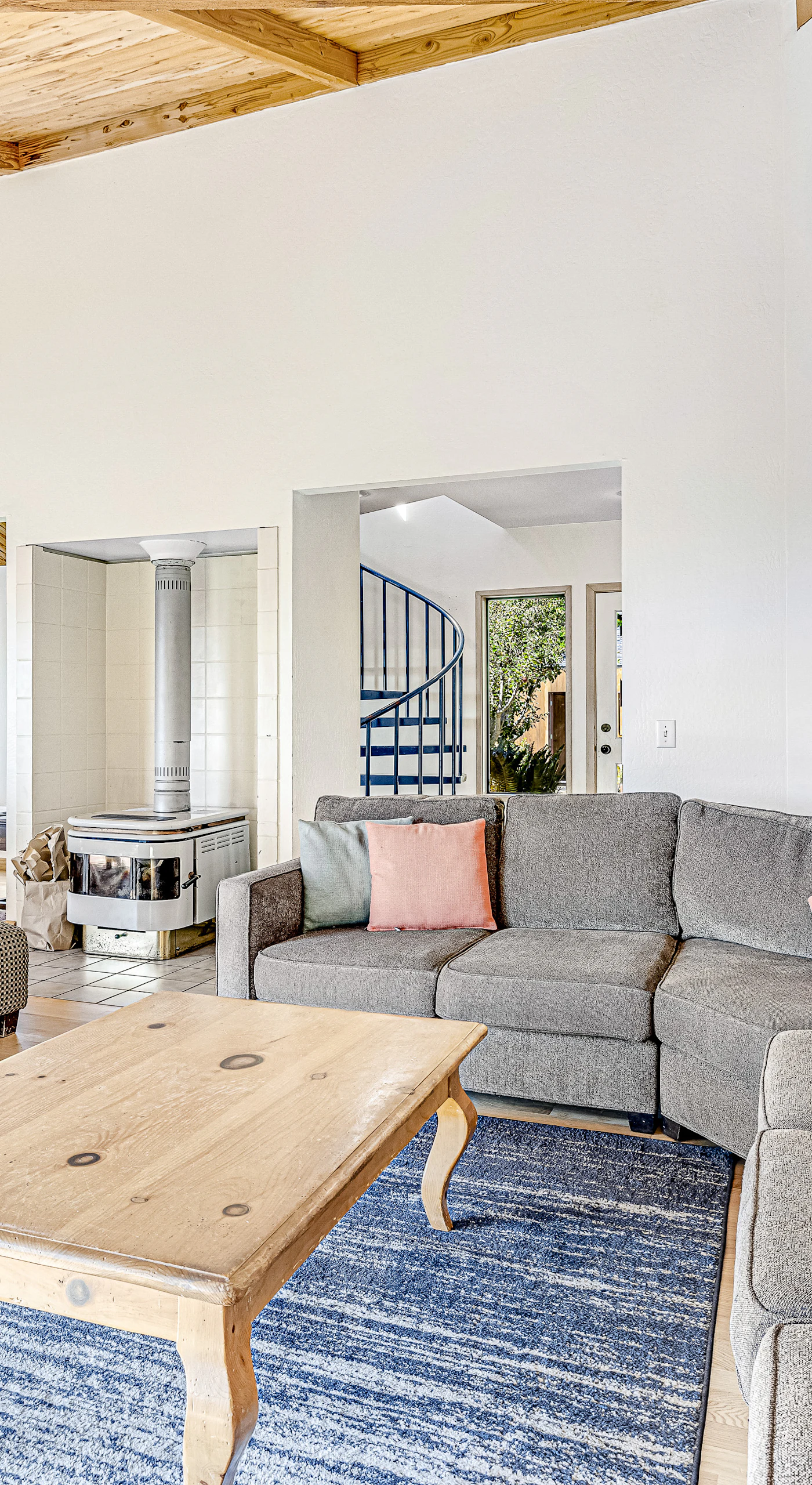 Gather around in this spacious living room, where stylish comfort meets stunning views through large windows.