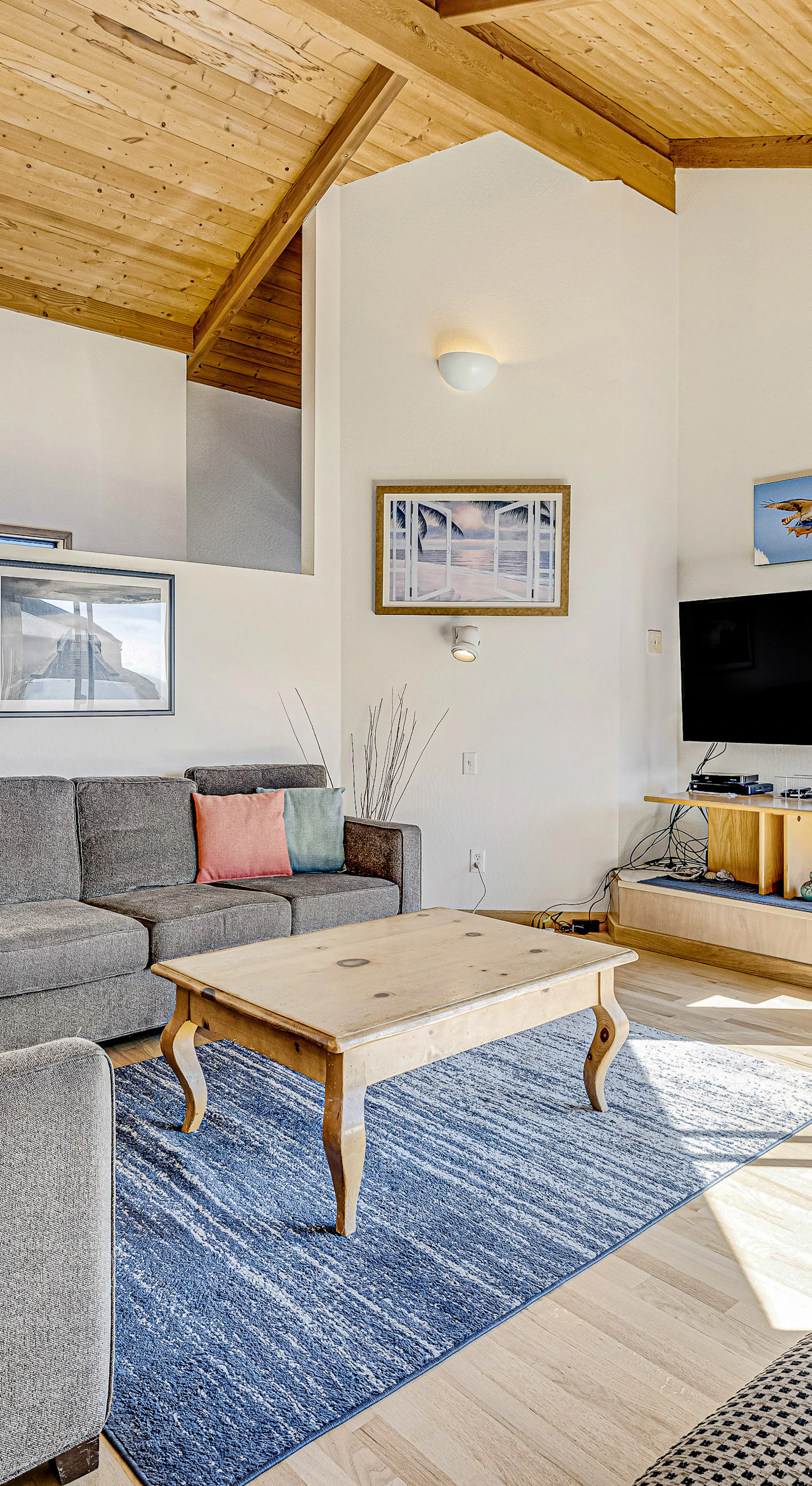 Morning light fills the living room, inviting you to relax with loved ones or enjoy a cozy movie night.