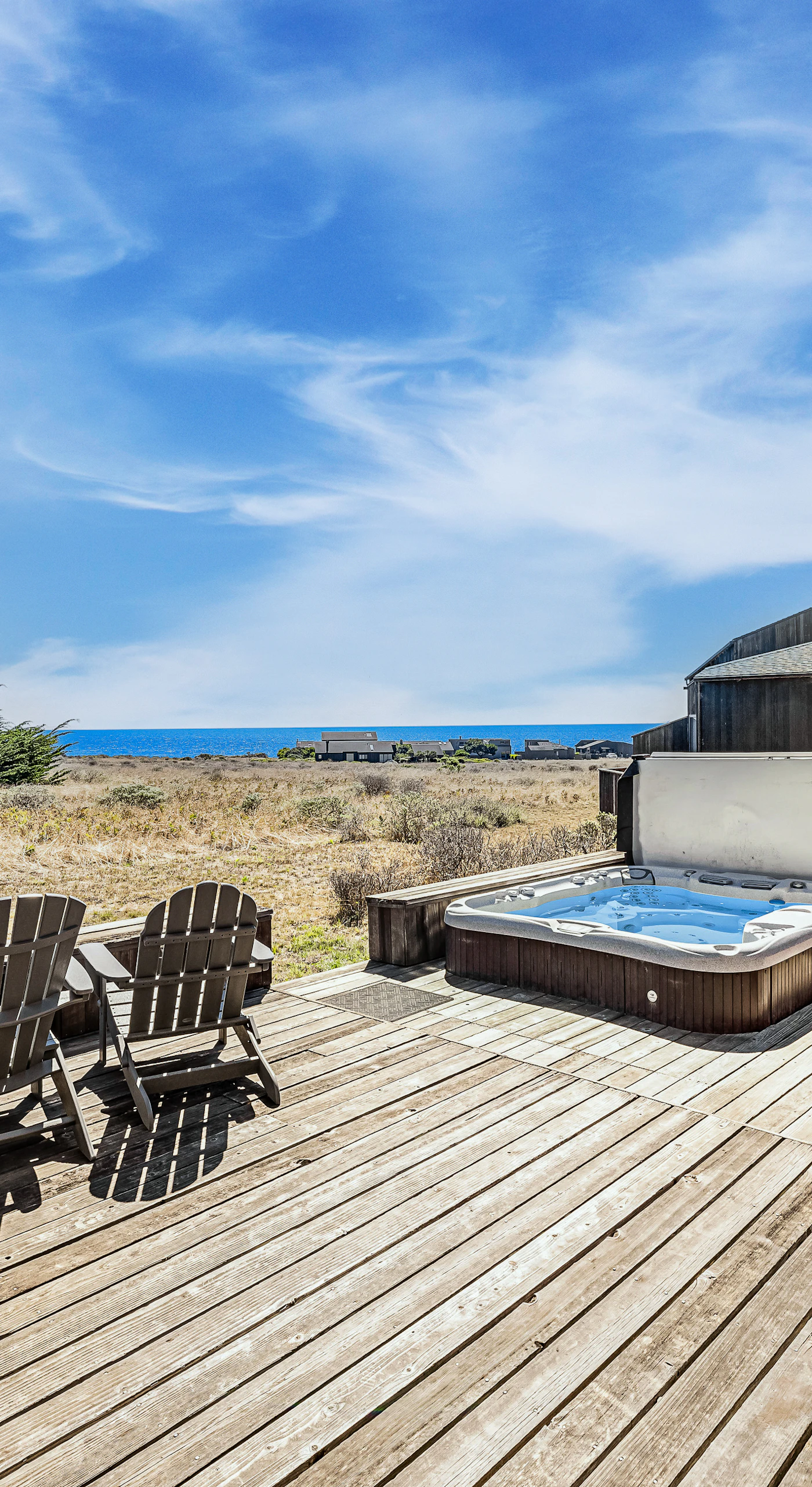 Soak in your private hot tub while gazing at the endless ocean view—perfect for unwinding after a day of adventure.